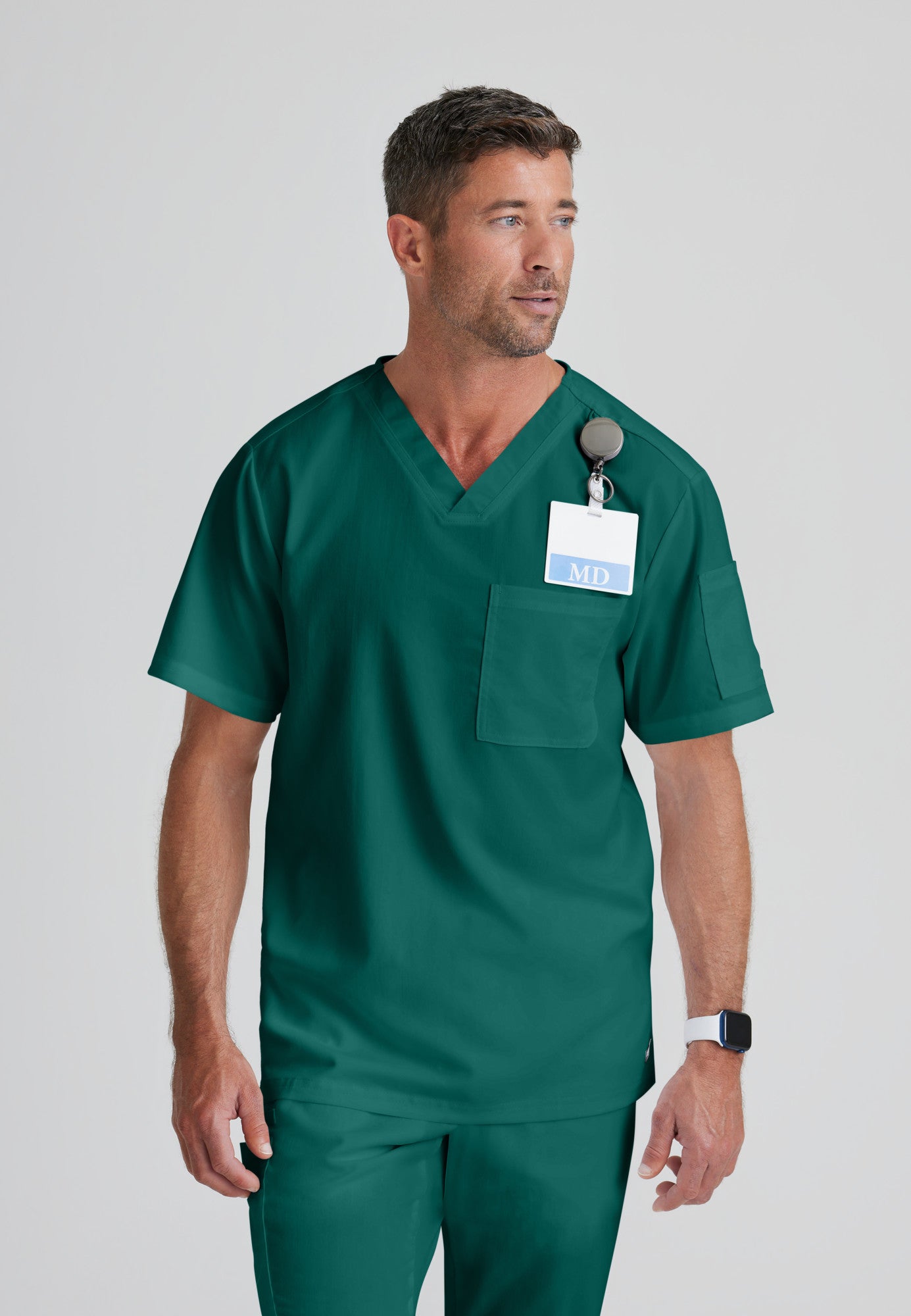 Front View of the Evan 2-Pocket V-Neck Scrub Top in Hunter Green from Grey's Anatomy™ by Barco Classic