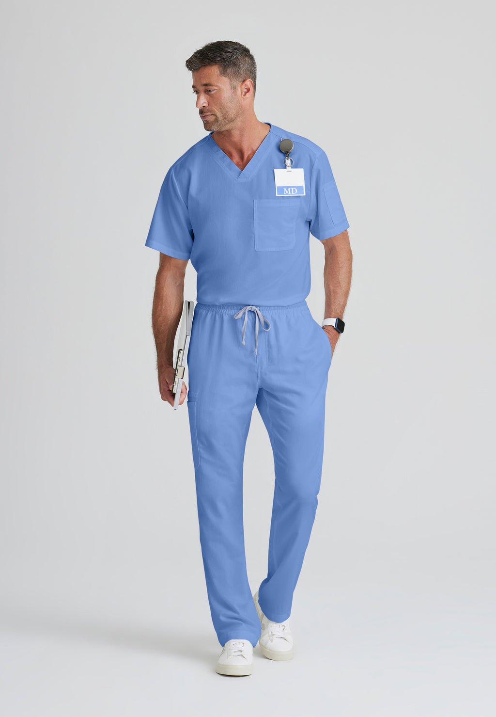 Full Body View of the Evan 2-Pocket V-Neck Scrub Top in Ciel Blue from Grey's Anatomy™ by Barco Classic