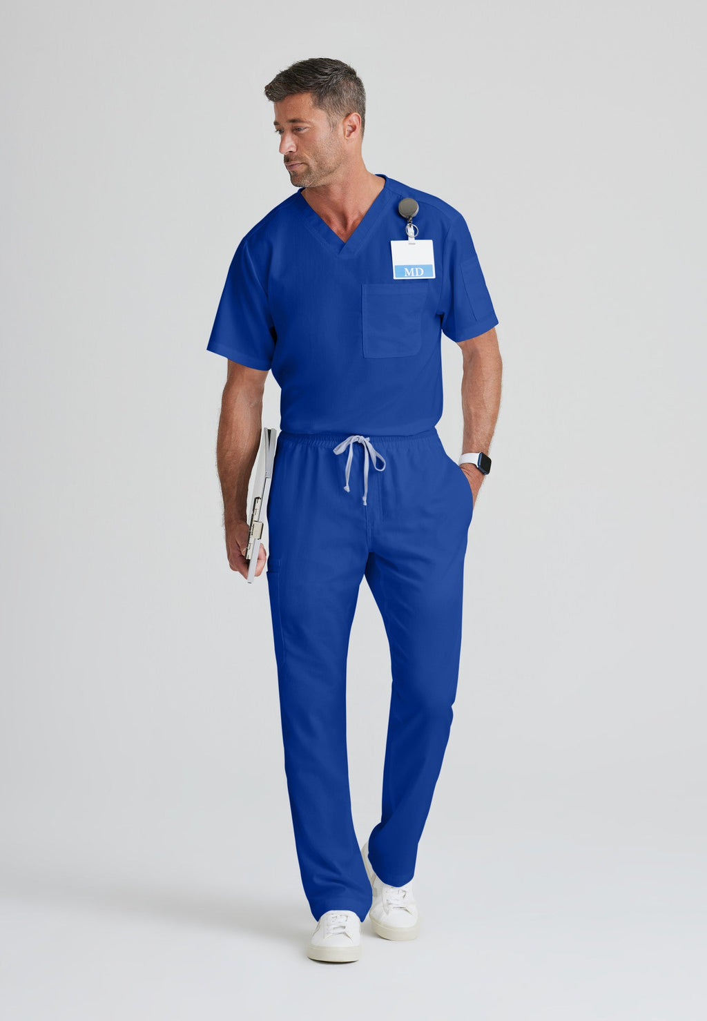 Full Body View of the Evan 2-Pocket V-Neck Scrub Top in Galaxy from Grey's Anatomy™ by Barco Classic