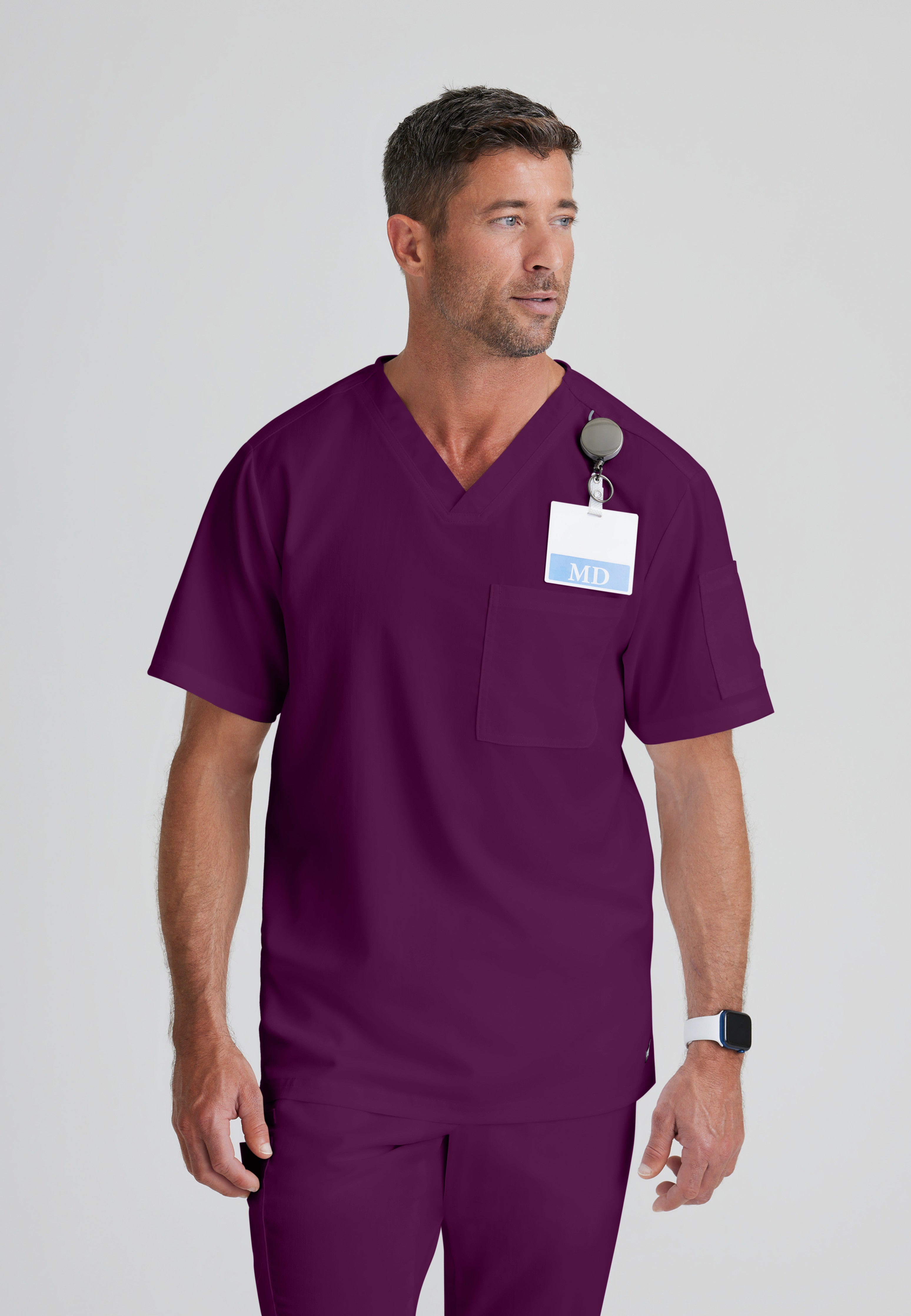 Front View of the Evan 2-Pocket V-Neck Scrub Top in Wine from Grey's Anatomy™ by Barco Classic