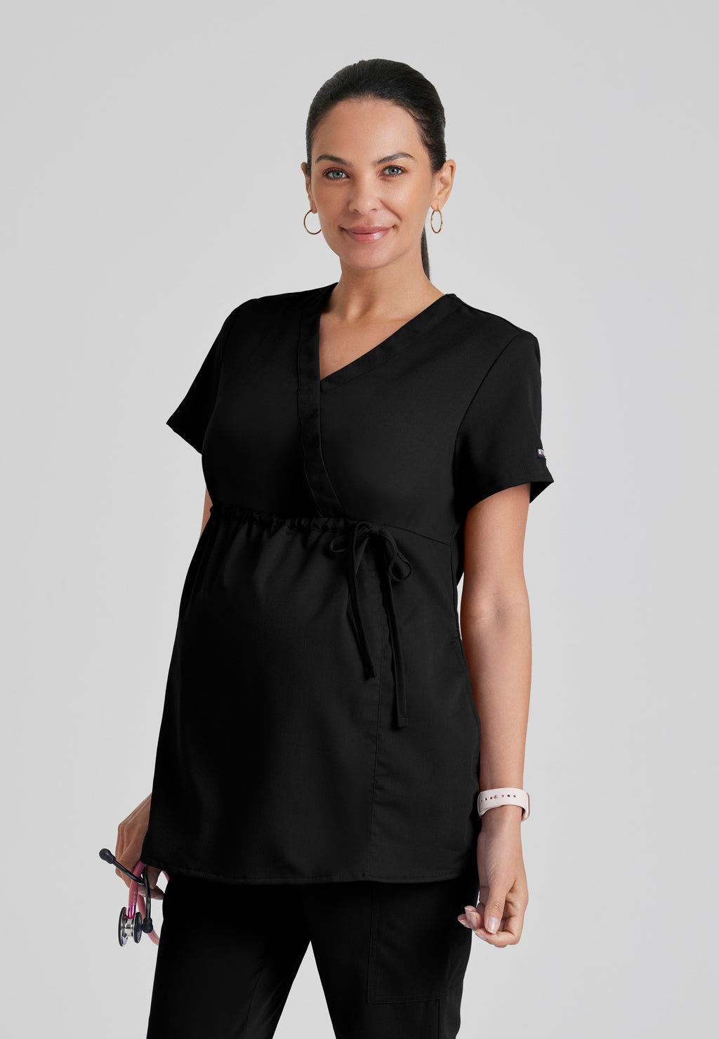 Front View of the Lilah 2-Pocket Mock Wrap Maternity Scrub Top in Black from Grey's Anatomy™ by Barco Classic
