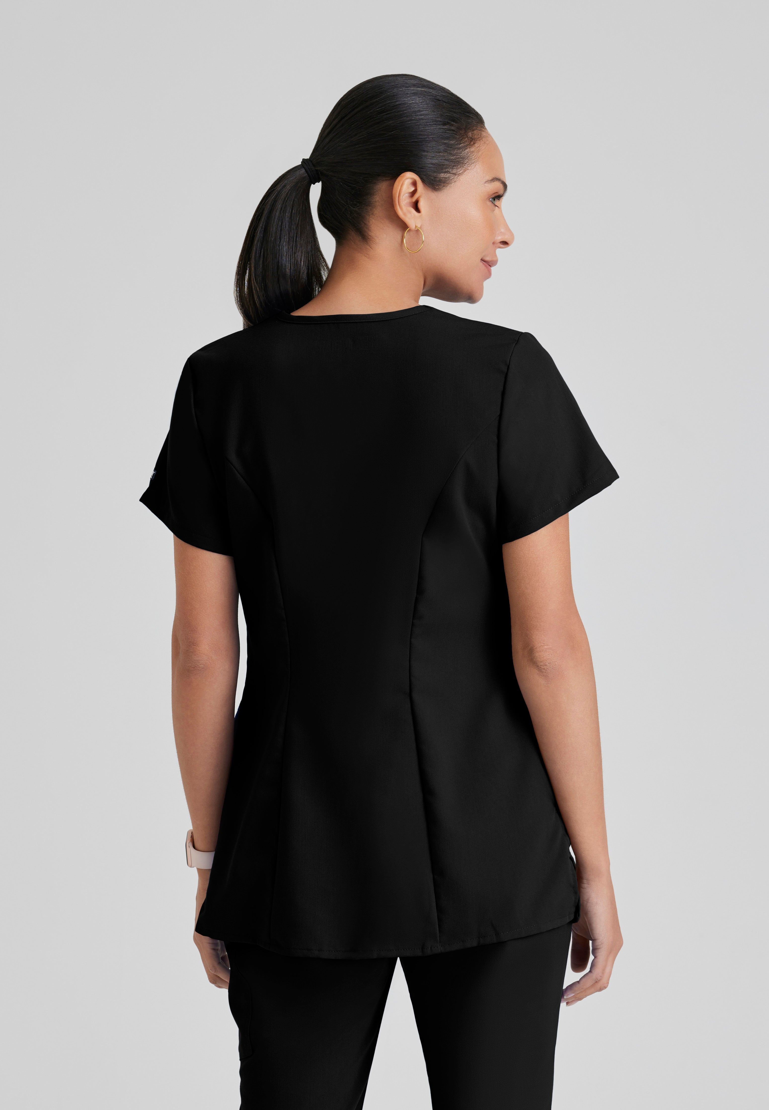 Back View of the Lilah 2-Pocket Mock Wrap Maternity Scrub Top in Black from Grey's Anatomy™ by Barco Classic