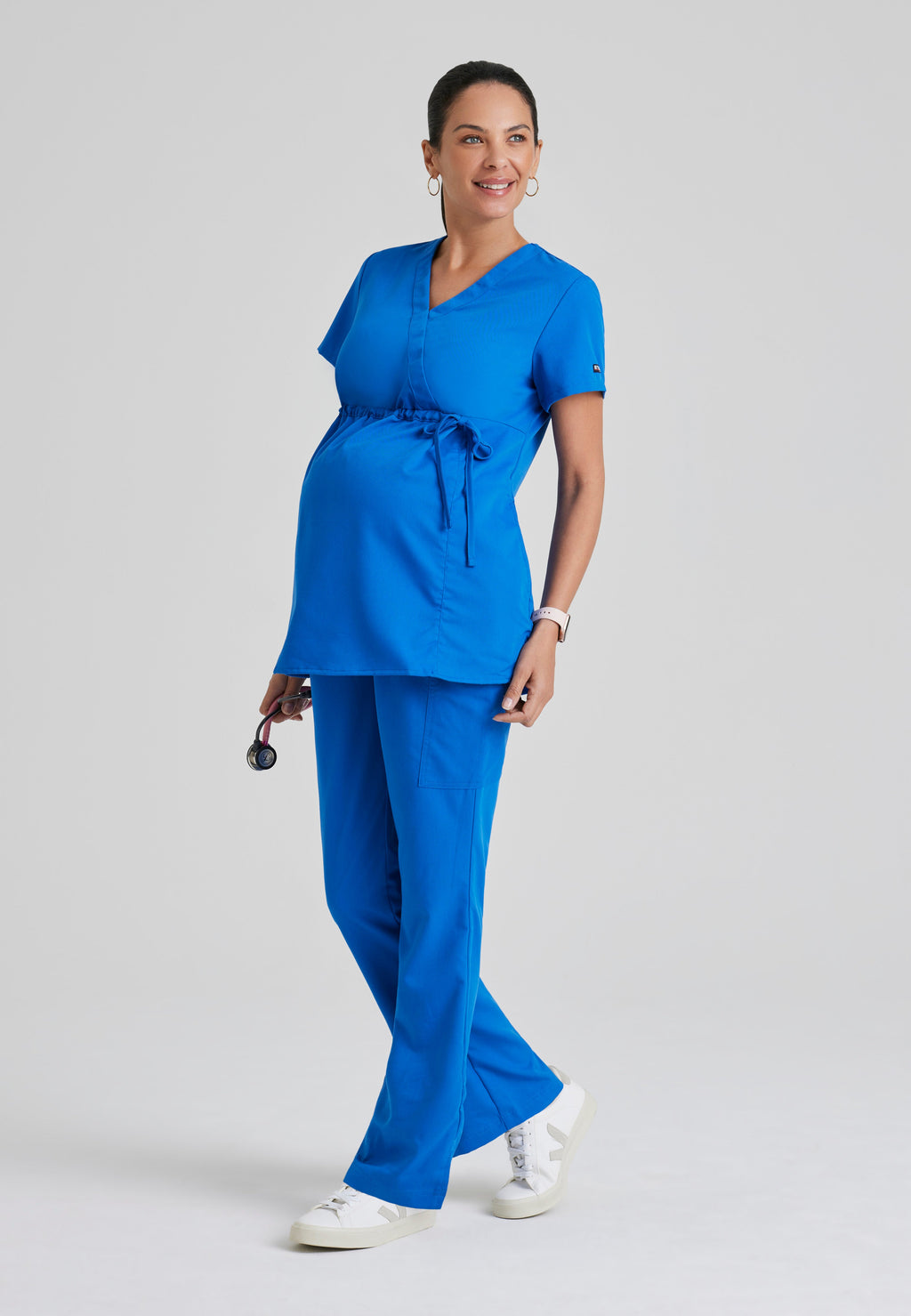 Full Body View of the Lilah 2-Pocket Mock Wrap Maternity Scrub Top in New Royal from Grey's Anatomy™ by Barco Classic