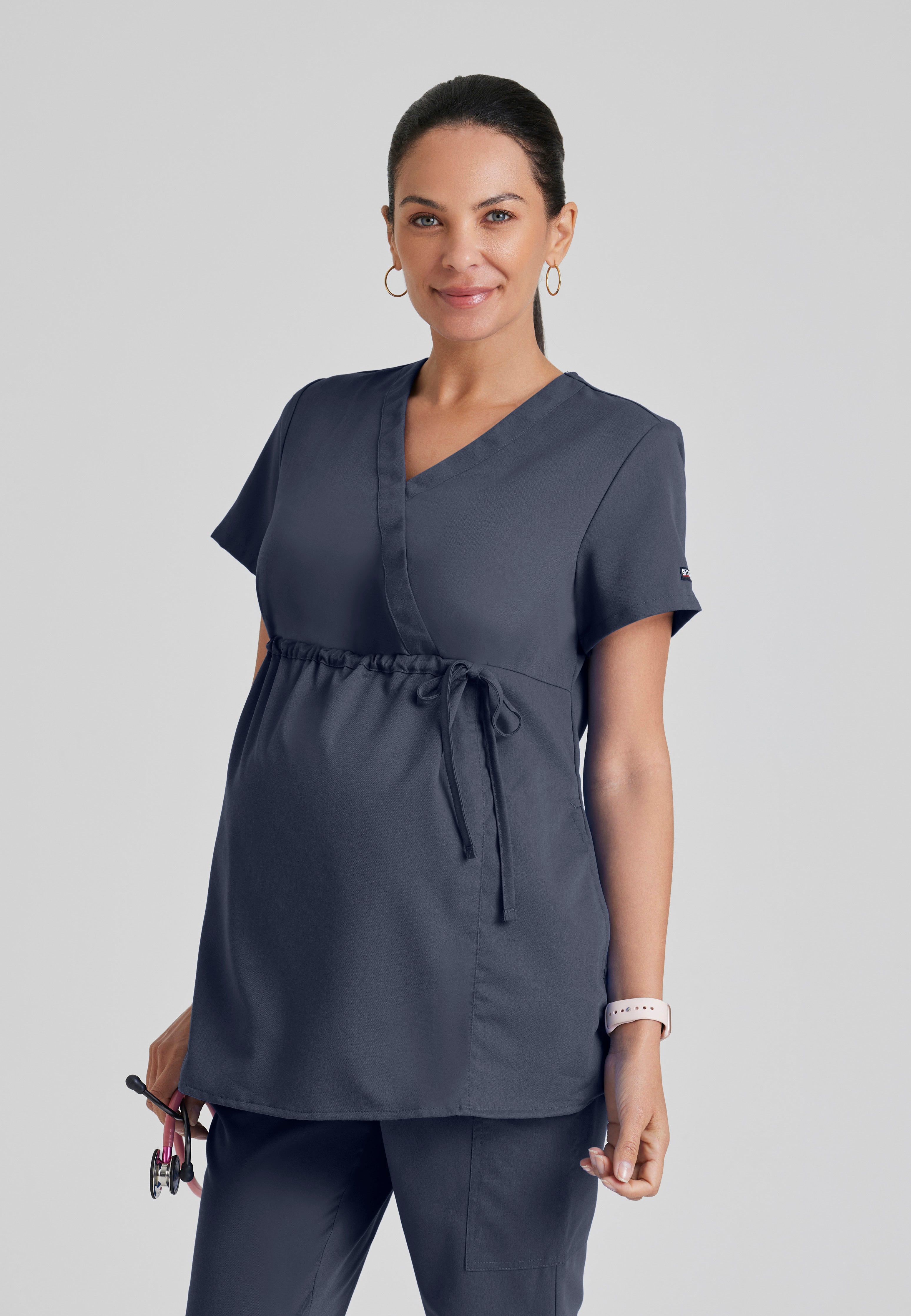 Front View of the Lilah 2-Pocket Mock Wrap Maternity Scrub Top in Steel from Grey's Anatomy™ by Barco Classic