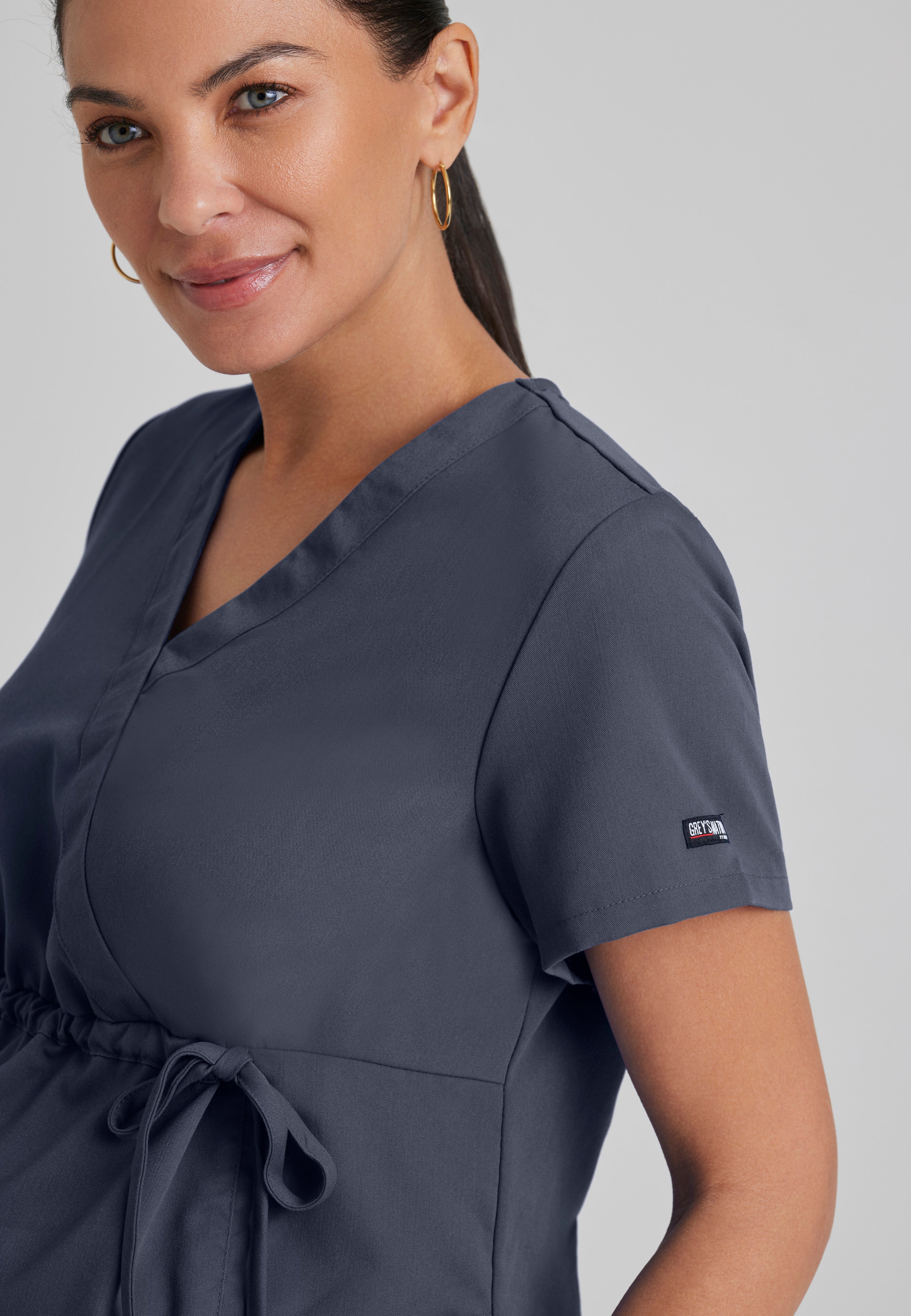 Detail Shot of the Lilah 2-Pocket Mock Wrap Maternity Scrub Top in Steel from Grey's Anatomy™ by Barco Classic
