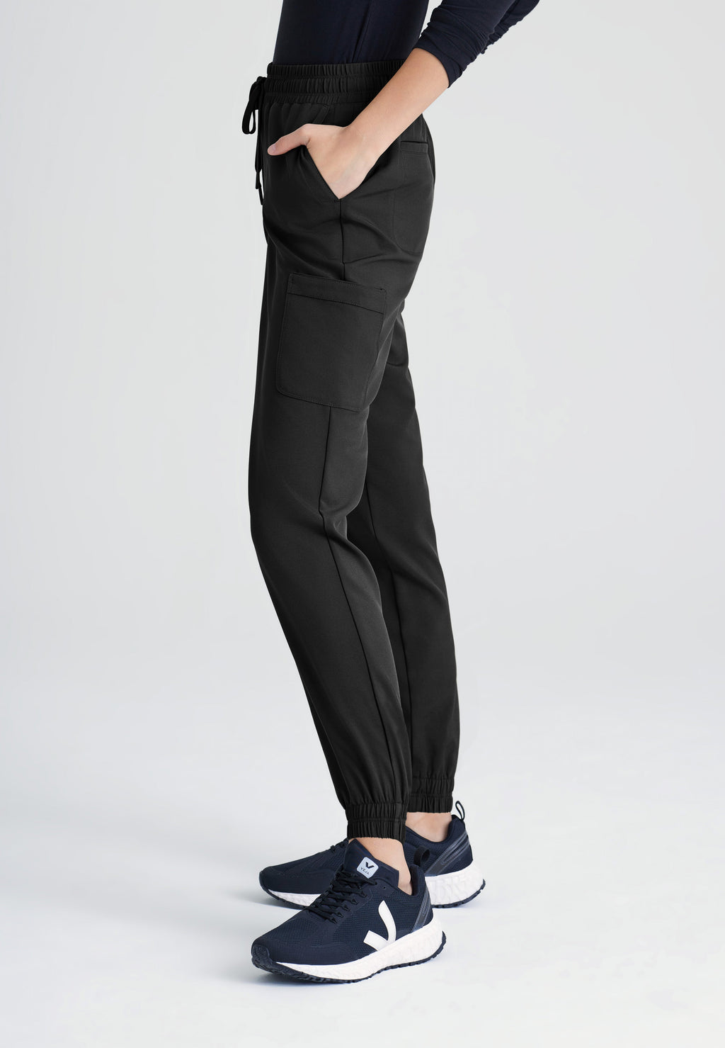 Side View of the Terra 6-Pocket Mid-Rise Ciclo® Jogger Scrub Pant in Black from Grey's Anatomy™ by Barco Evolve