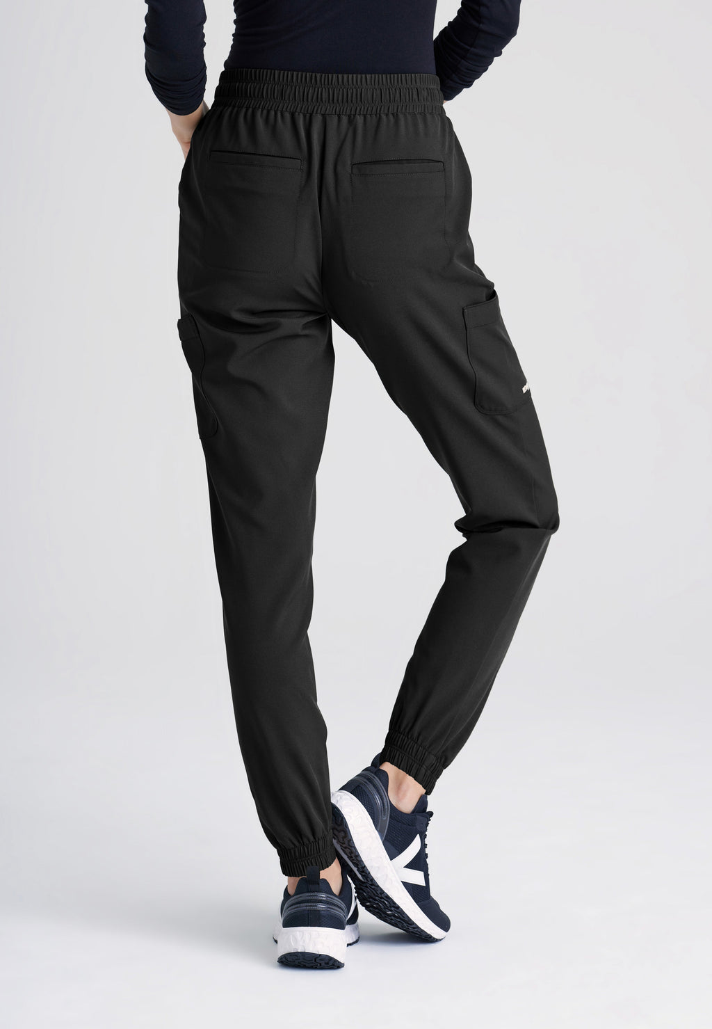 Back View of the Terra 6-Pocket Mid-Rise Ciclo® Jogger Scrub Pant in Black from Grey's Anatomy™ by Barco Evolve