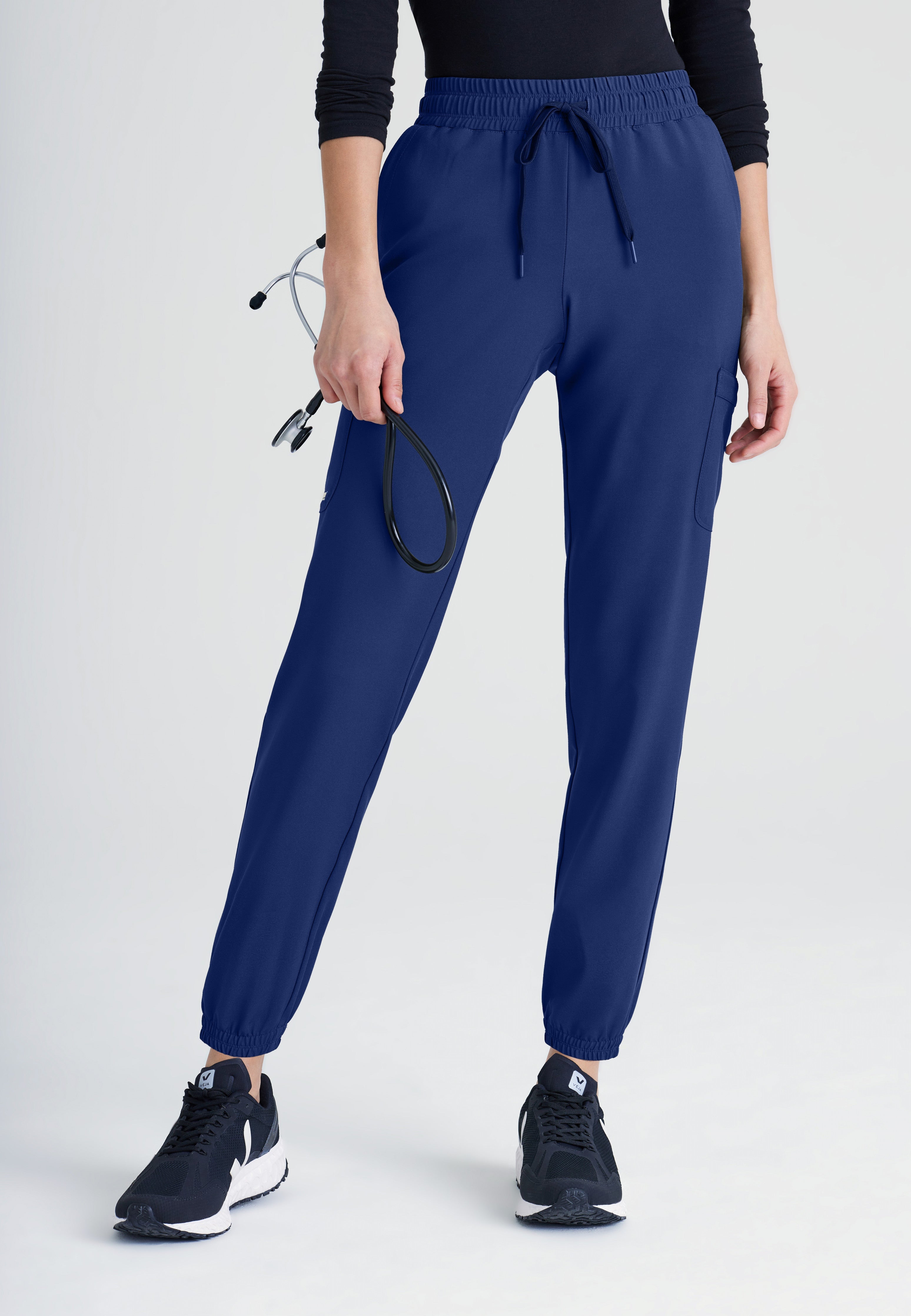 Front View of the Terra 6-Pocket Mid-Rise Ciclo® Jogger Scrub Pant in Indigo from Grey's Anatomy™ by Barco Evolve