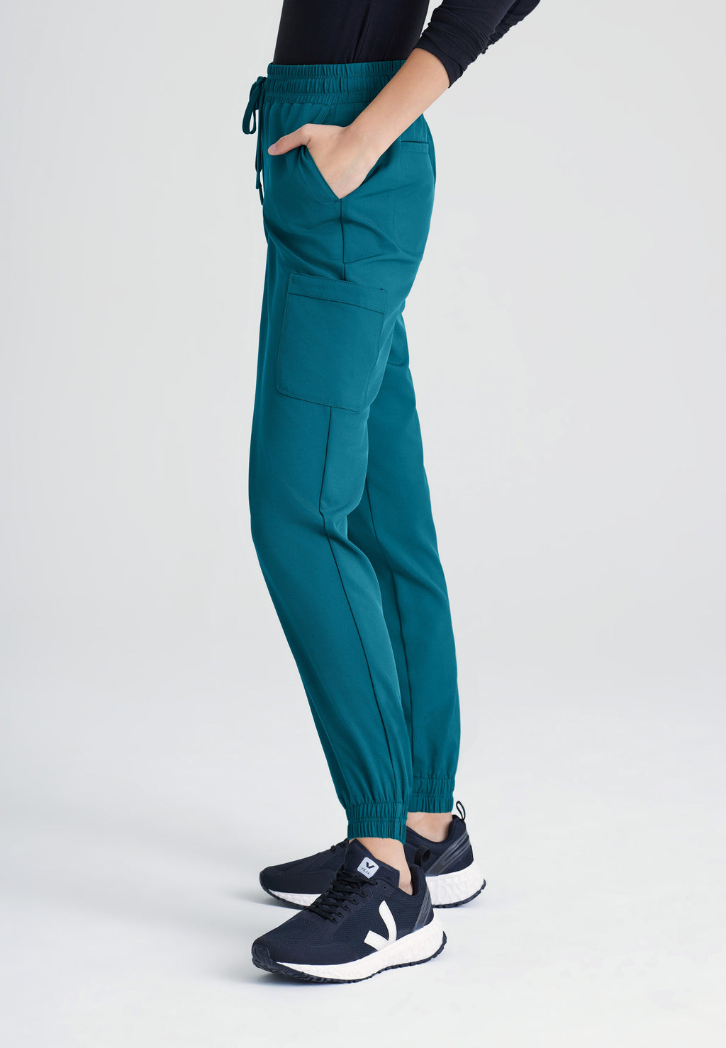 Side View of the Terra 6-Pocket Mid-Rise Ciclo® Jogger Scrub Pant in Bahama from Grey's Anatomy™ by Barco Evolve