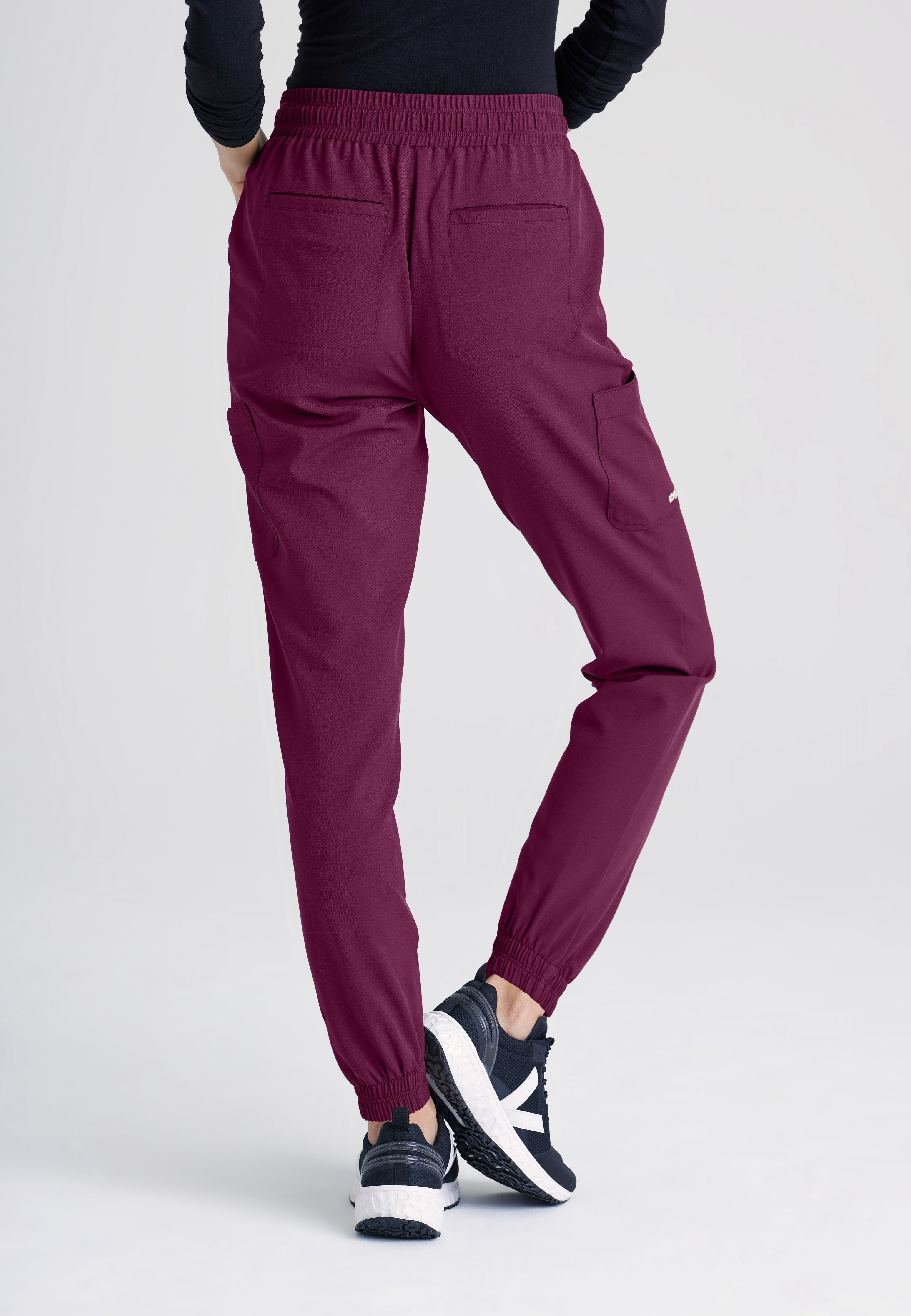 Back View of the Terra 6-Pocket Mid-Rise Ciclo® Jogger Scrub Pant in Wine from Grey's Anatomy™ by Barco Evolve
