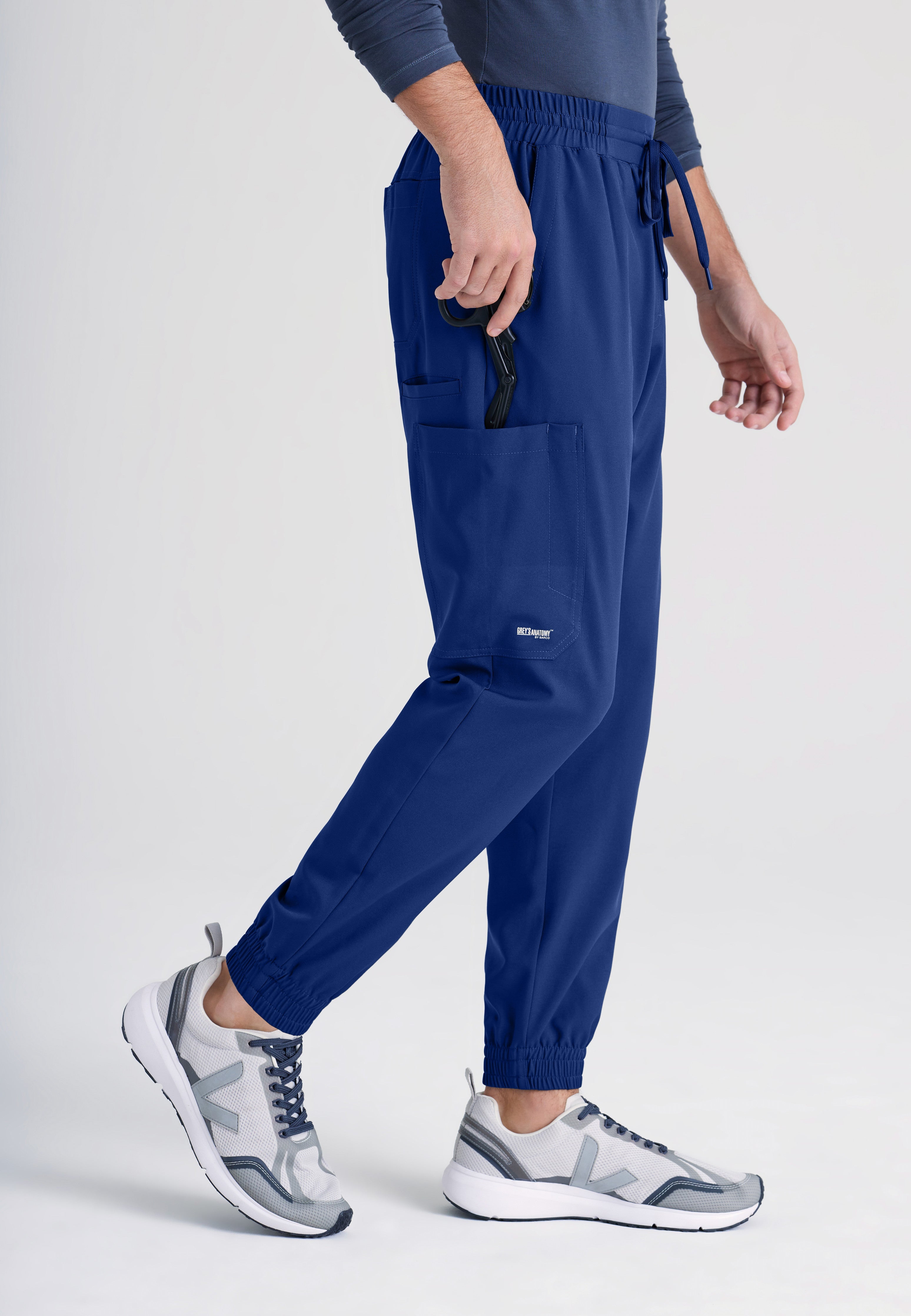 Side View of the Voyager 5-Pocket CICLO® Jogger Scrub Pant in Indigo from Grey's Anatomy™ by Barco Evolve