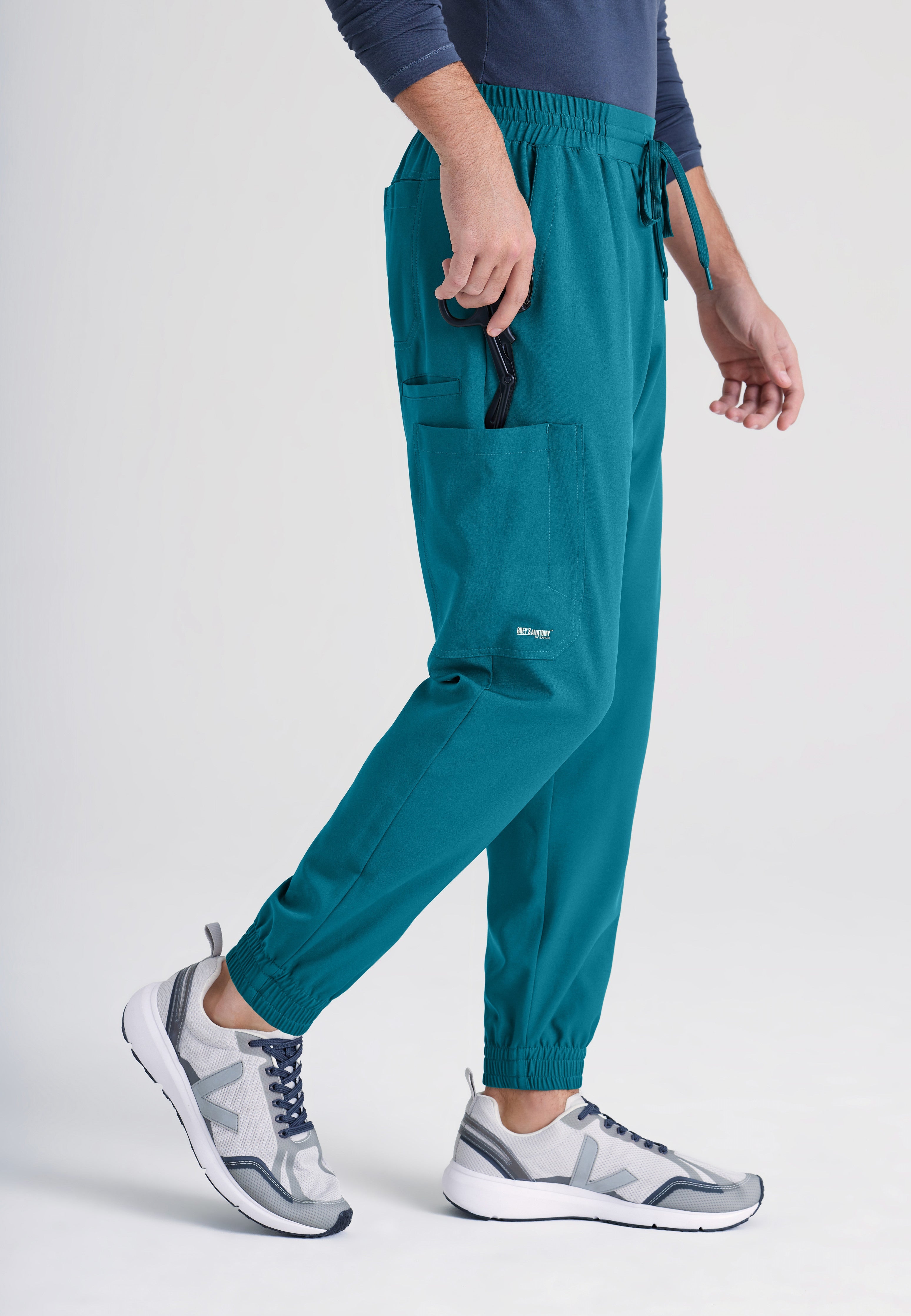 Side View of the Voyager 5-Pocket CICLO® Jogger Scrub Pant in Bahama from Grey's Anatomy™ by Barco Evolve