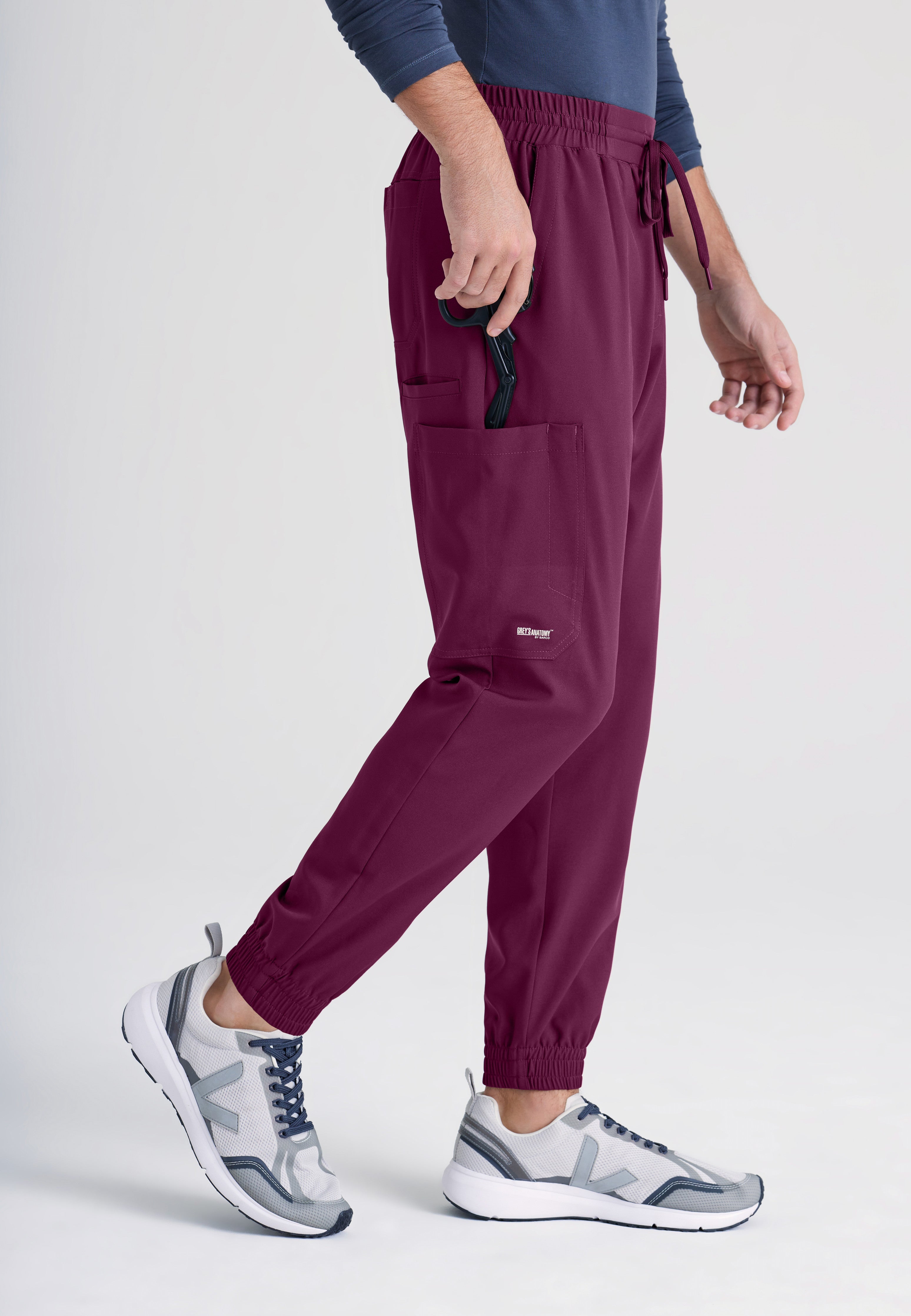 Side View of the Voyager 5-Pocket CICLO® Jogger Scrub Pant in Wine from Grey's Anatomy™ by Barco Evolve