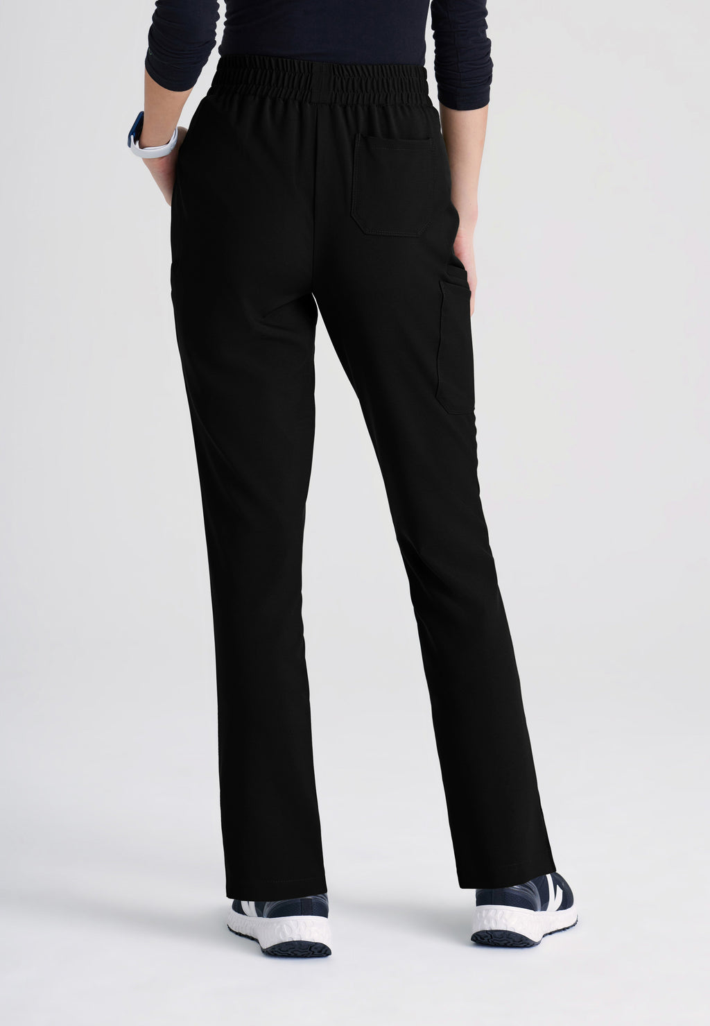 Back View of the Cosmo 6-Pocket Mid-Rise Tapered Leg Ciclo® Scrub Pant in Black from Grey's Anatomy™ by Barco Evolve