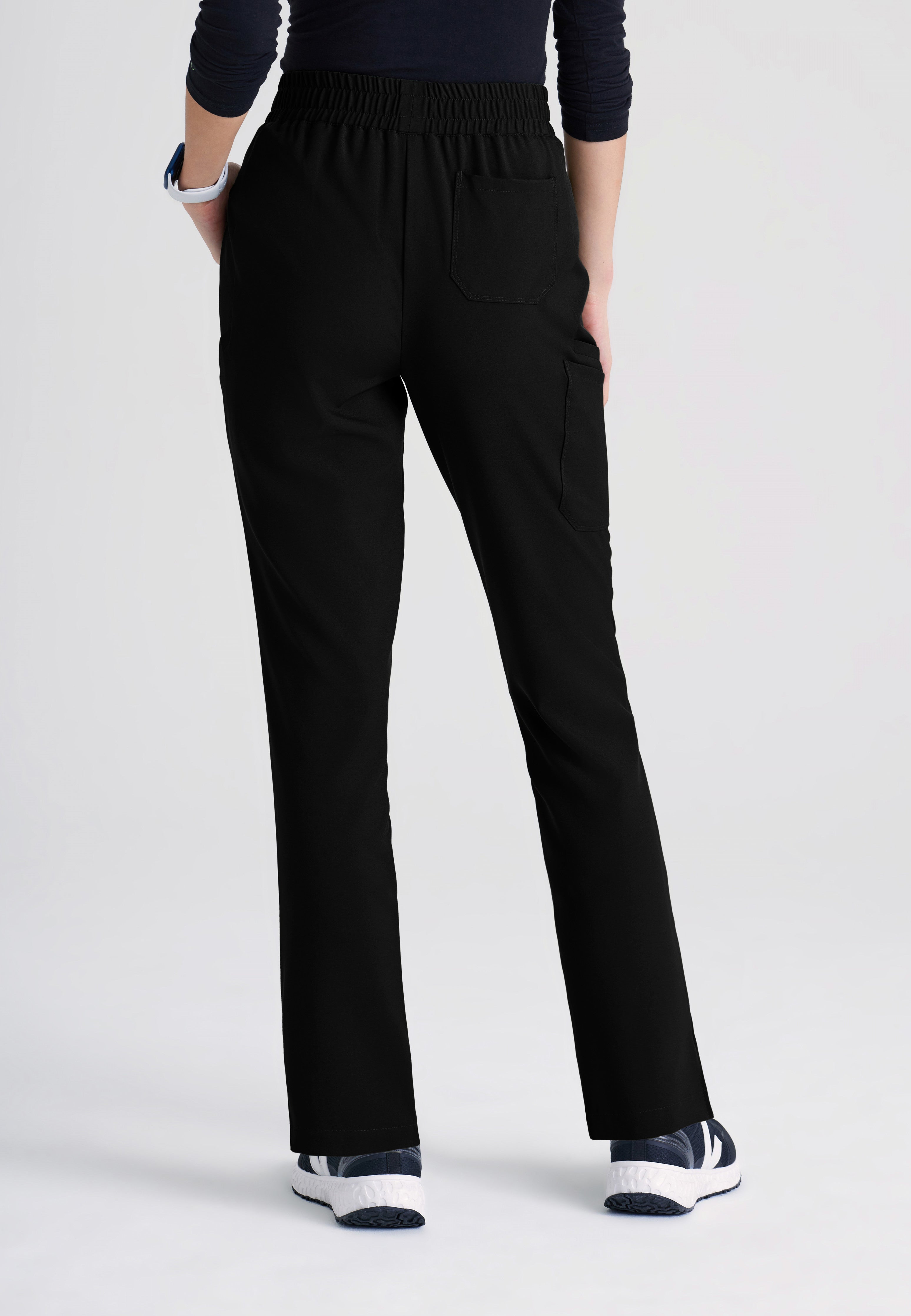 Back View of the Cosmo 6-Pocket Mid-Rise Tapered Leg Ciclo® Scrub Pant in Black from Grey's Anatomy™ by Barco Evolve
