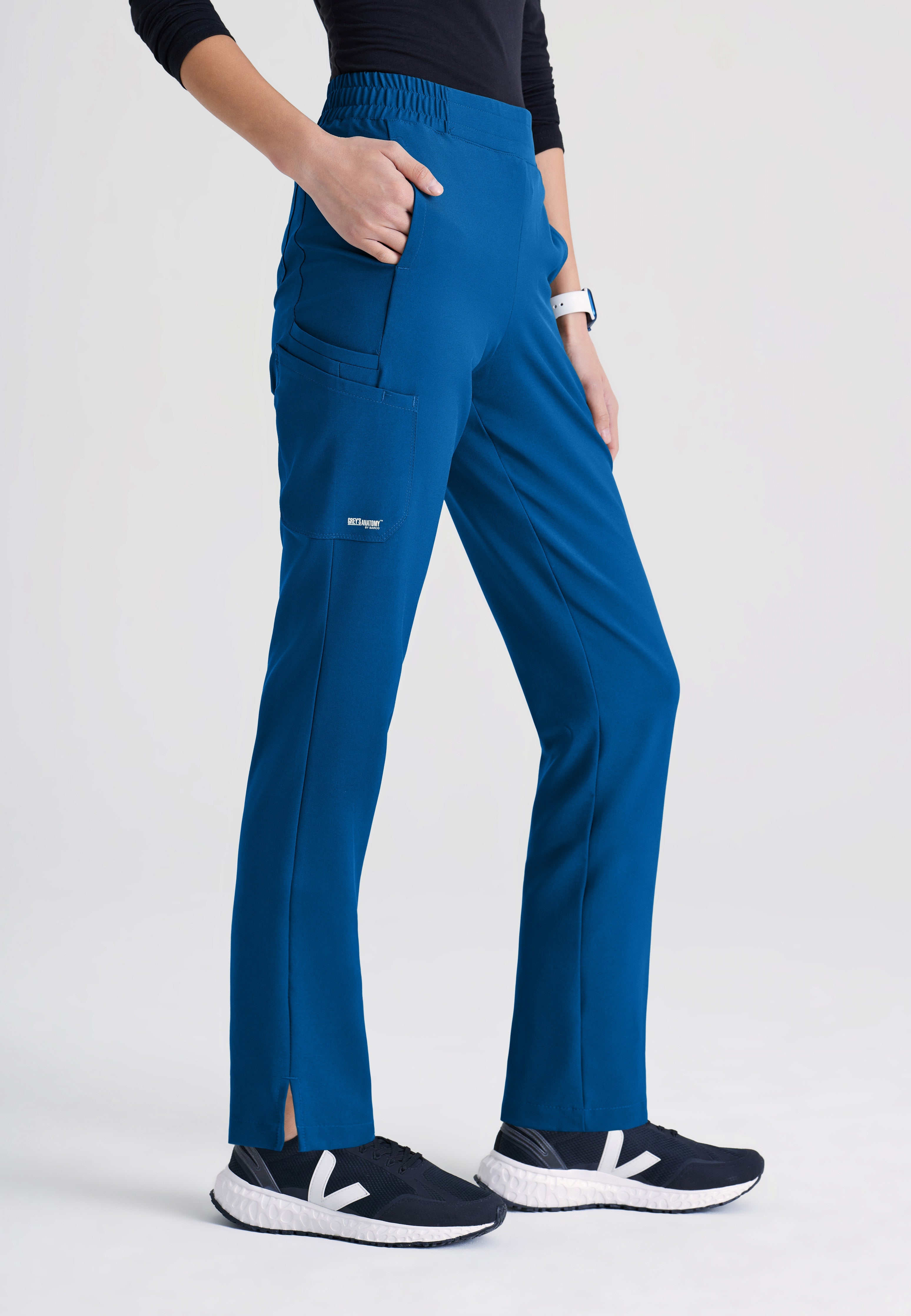 Side View of the Cosmo 6-Pocket Mid-Rise Tapered Leg Ciclo® Scrub Pant in New Royal from Grey's Anatomy™ by Barco Evolve