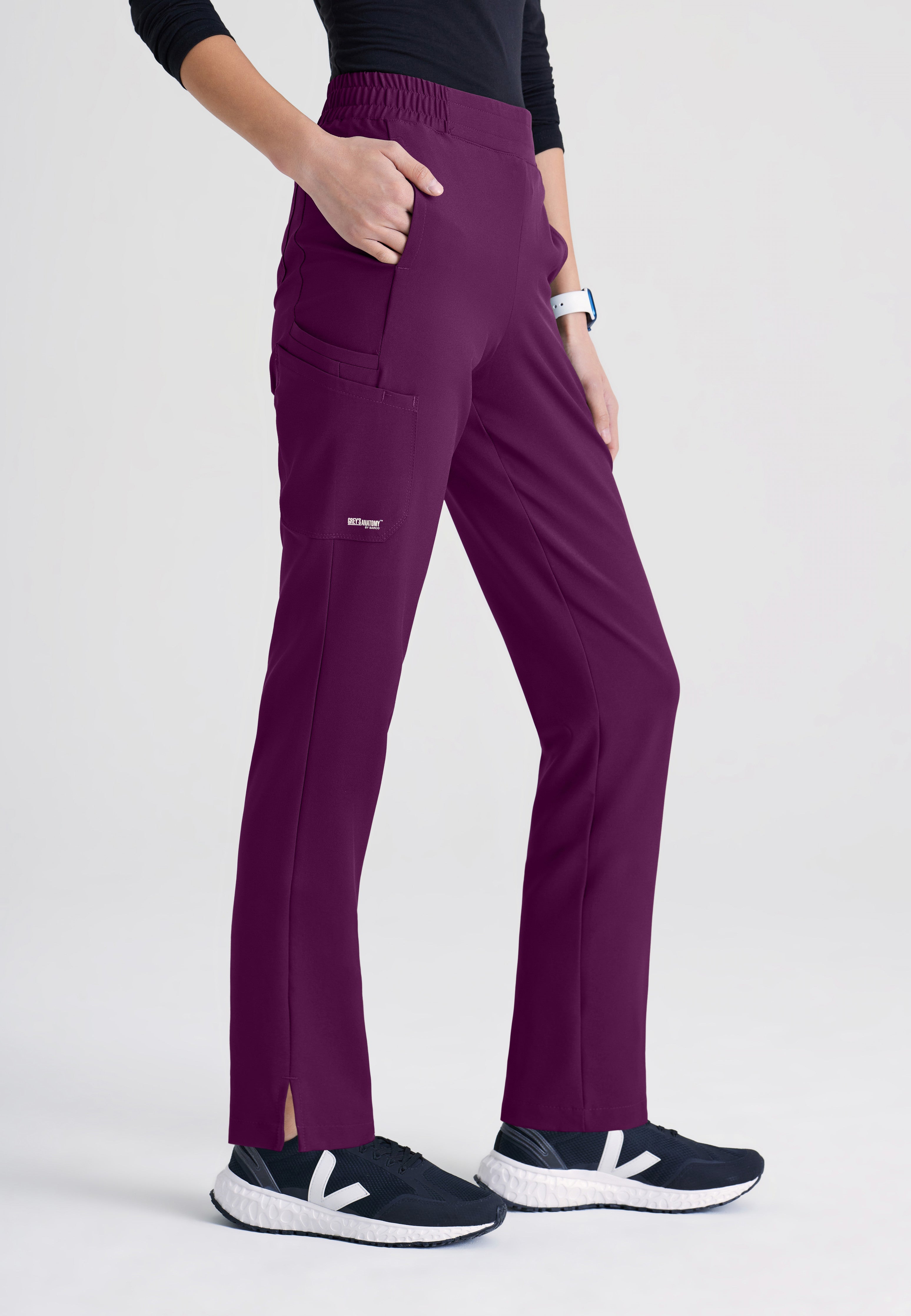 Side View of the Cosmo 6-Pocket Mid-Rise Tapered Leg Ciclo® Scrub Pant in Wine from Grey's Anatomy™ by Barco Evolve