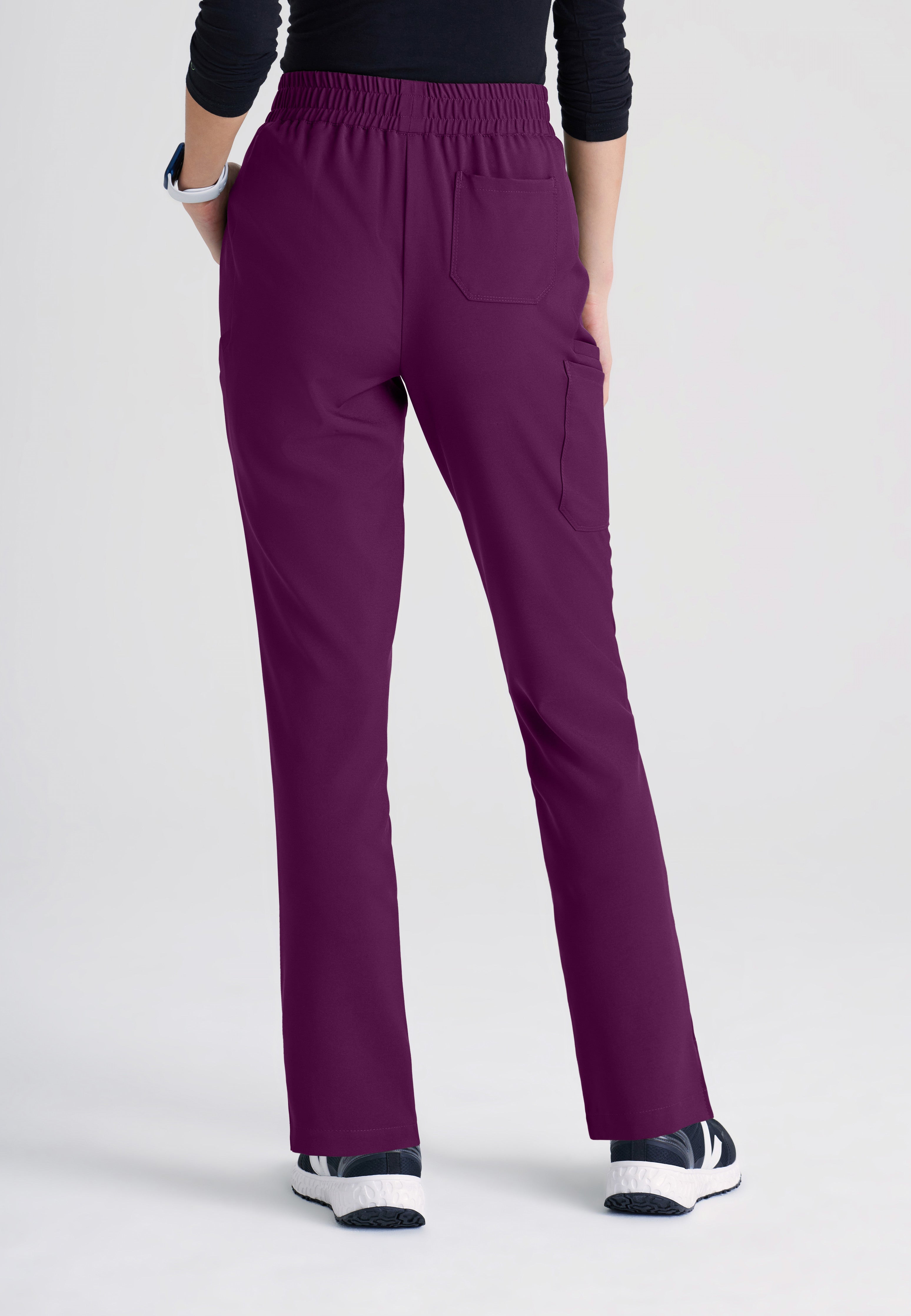 Back View of the Cosmo 6-Pocket Mid-Rise Tapered Leg Ciclo® Scrub Pant in Wine from Grey's Anatomy™ by Barco Evolve