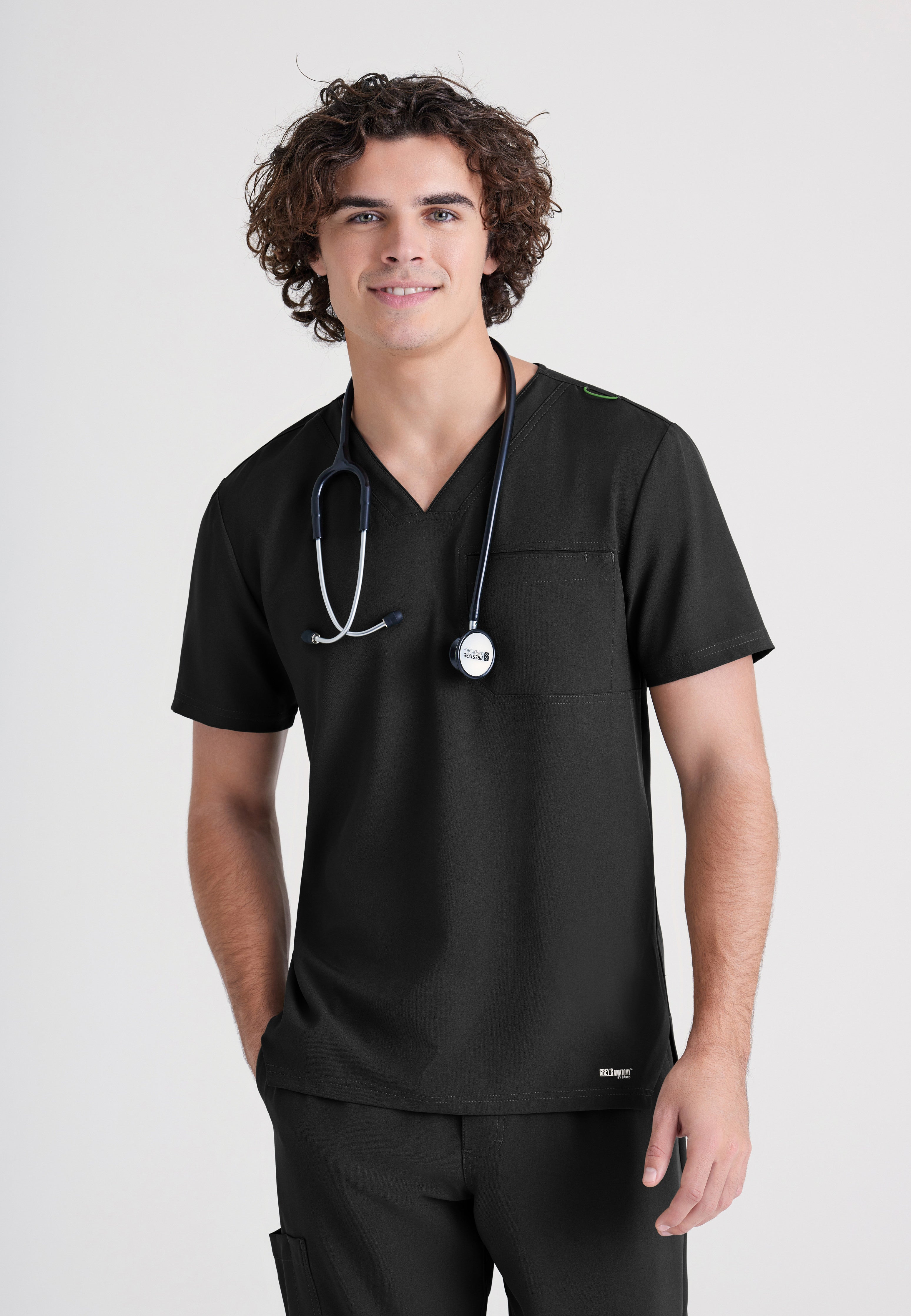 Front View of the Journey 1-Pocket Ciclo® Scrub Top in Black from Grey's Anatomy™ by Barco Evolve