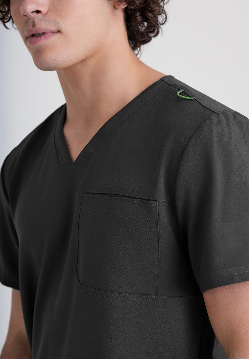 Detail Shot of the Journey 1-Pocket Ciclo® Scrub Top in Black from Grey's Anatomy™ by Barco Evolve