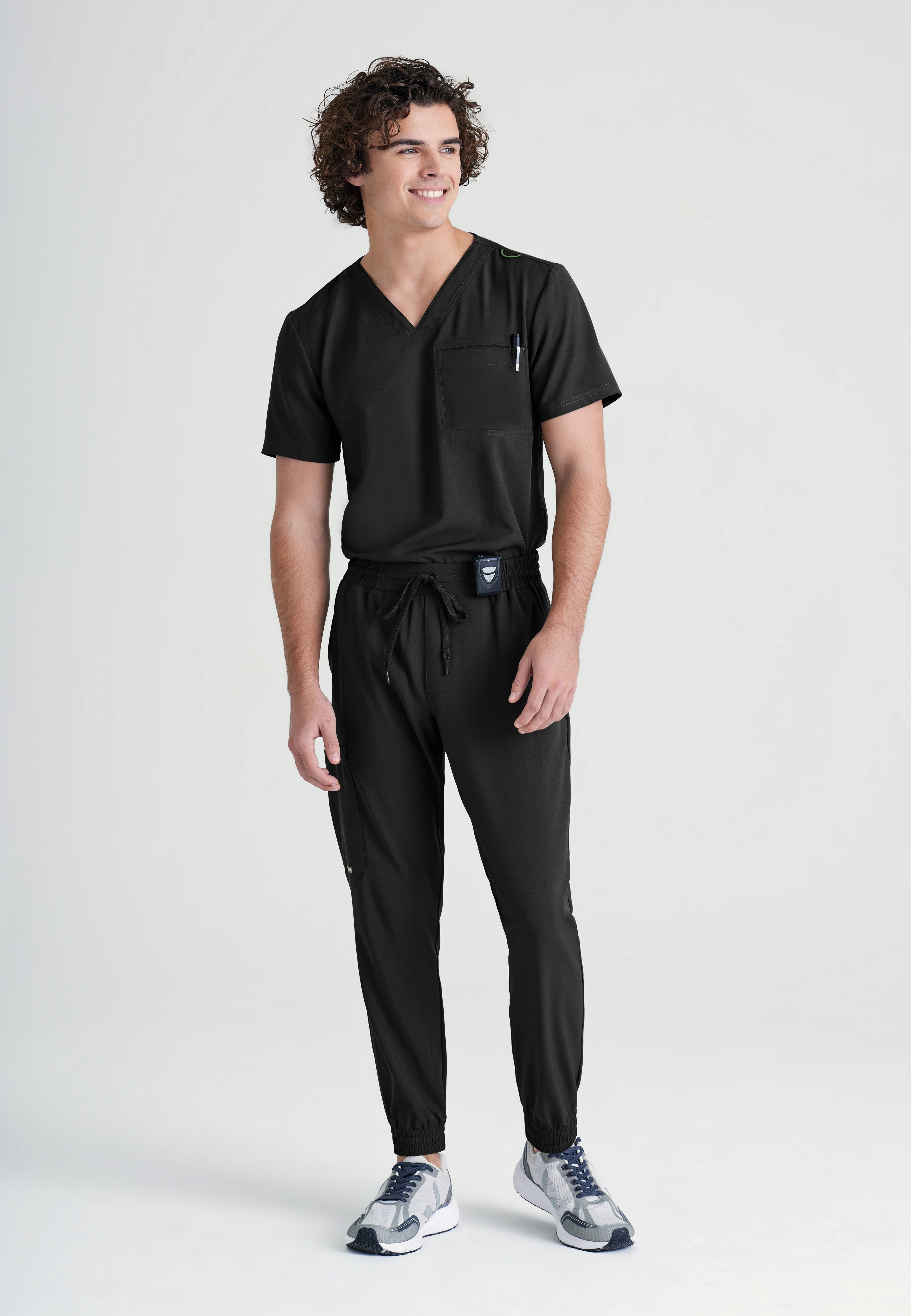Full Body View of the Journey 1-Pocket Ciclo® Scrub Top in Black from Grey's Anatomy™ by Barco Evolve