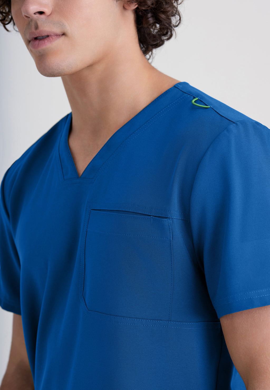 Detail Shot of the Journey 1-Pocket Ciclo® Scrub Top in New Royal from Grey's Anatomy™ by Barco Evolve