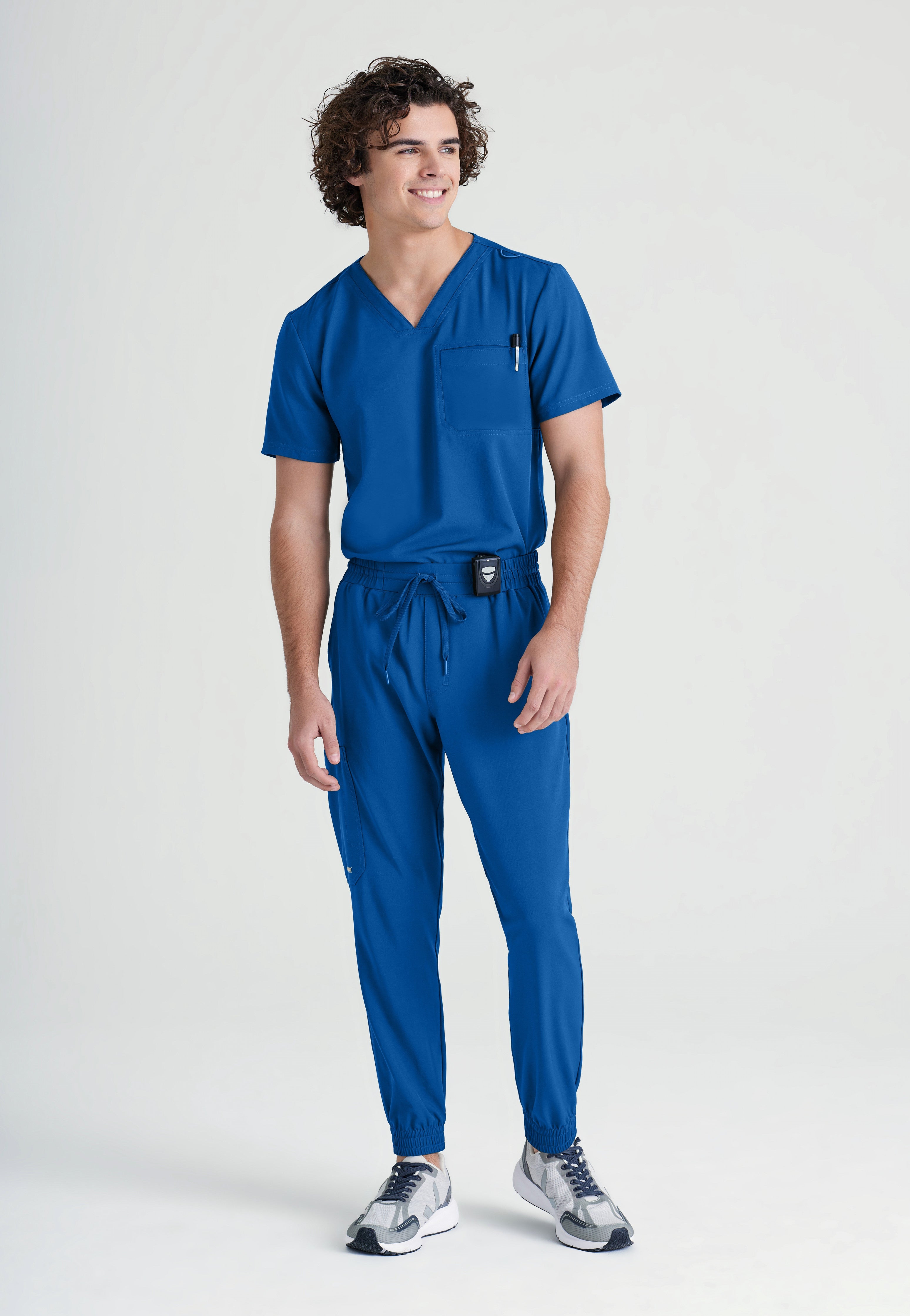 Full Body View of the Voyager 5-Pocket CICLO® Jogger Scrub Pant in New Royal from Grey's Anatomy™ by Barco Evolve