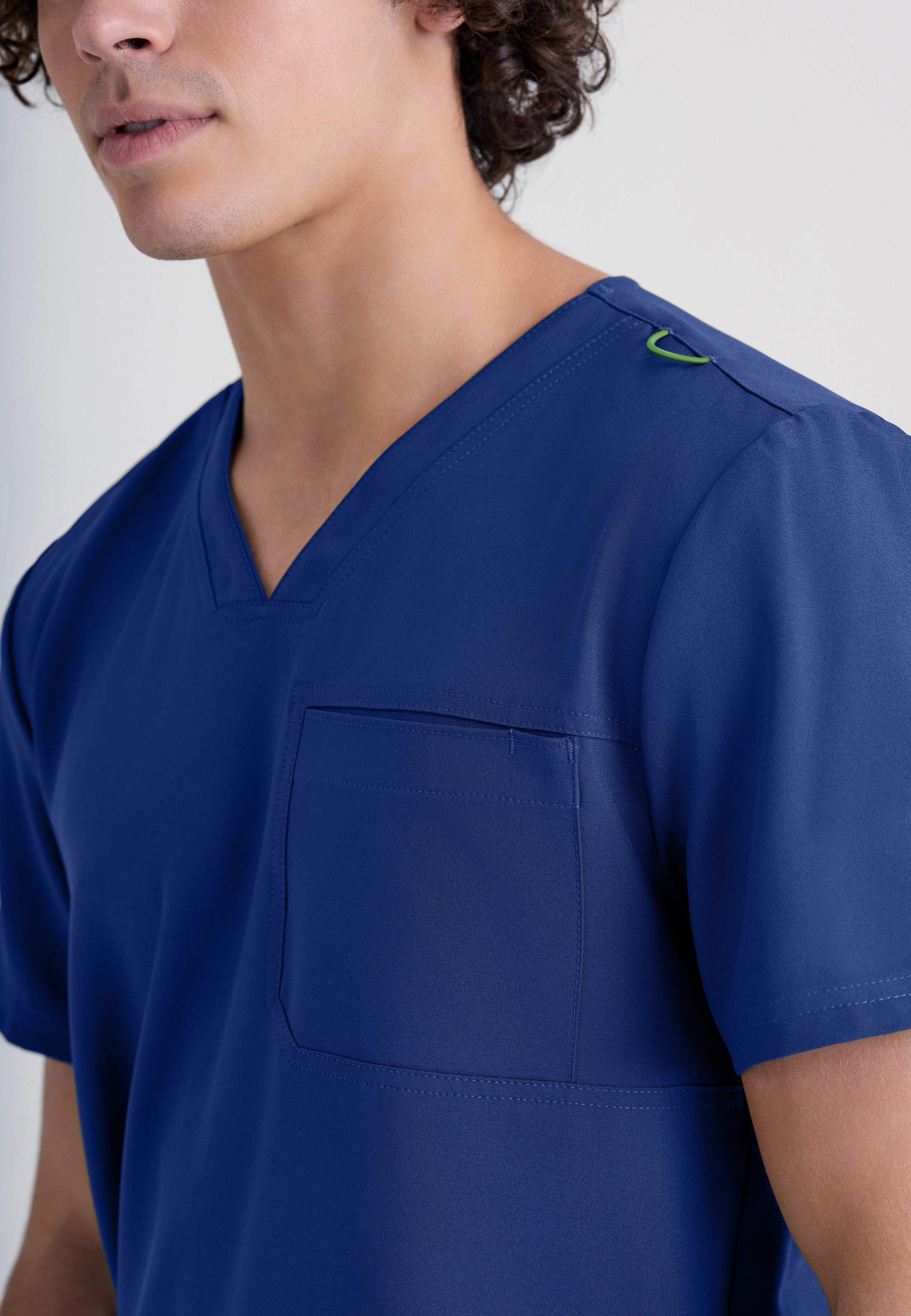 Detail Shot of the Journey 1-Pocket Ciclo® Scrub Top in Indigo from Grey's Anatomy™ by Barco Evolve
