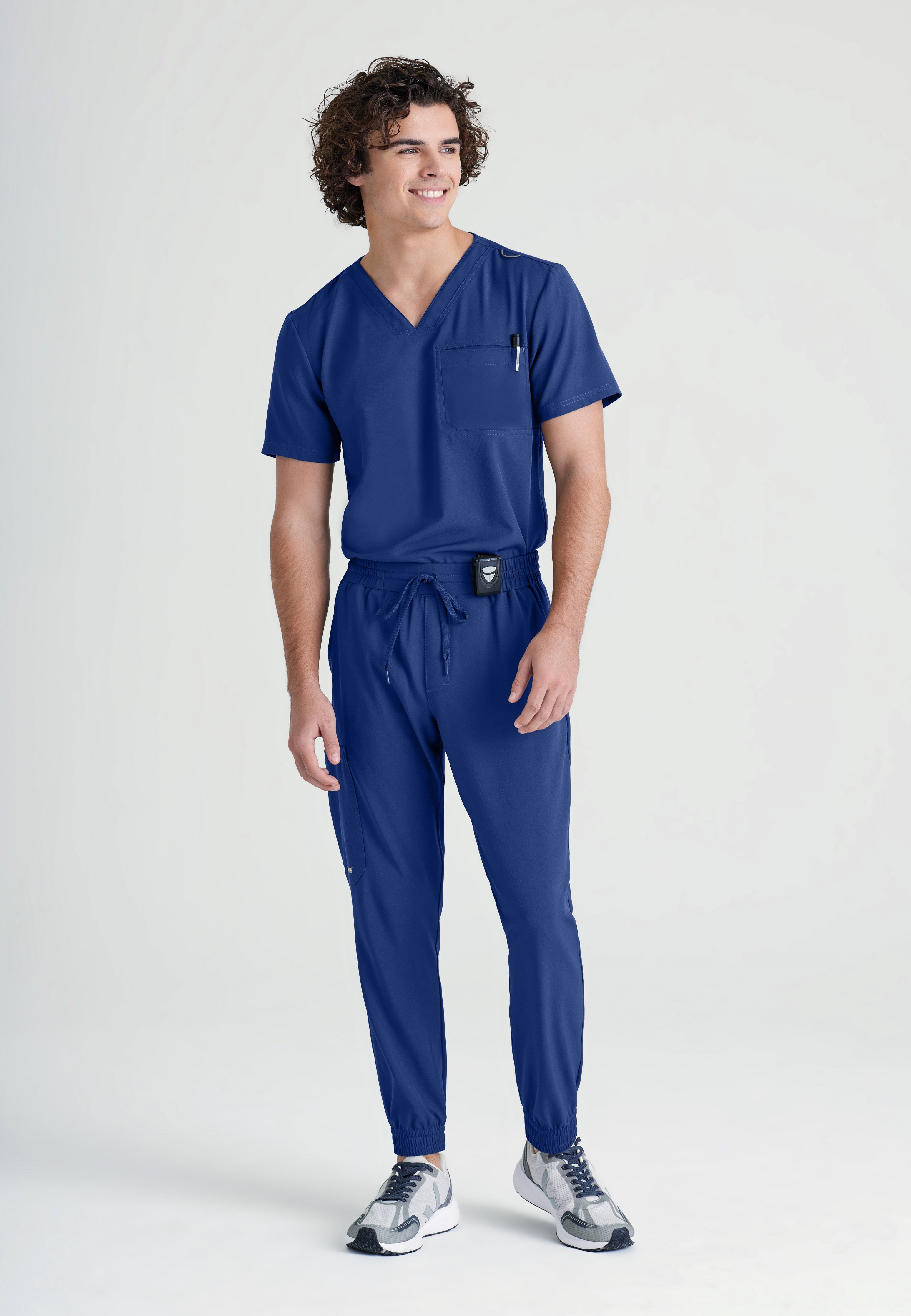 Full Body View of the Voyager 5-Pocket CICLO® Jogger Scrub Pant in Indigo from Grey's Anatomy™ by Barco Evolve