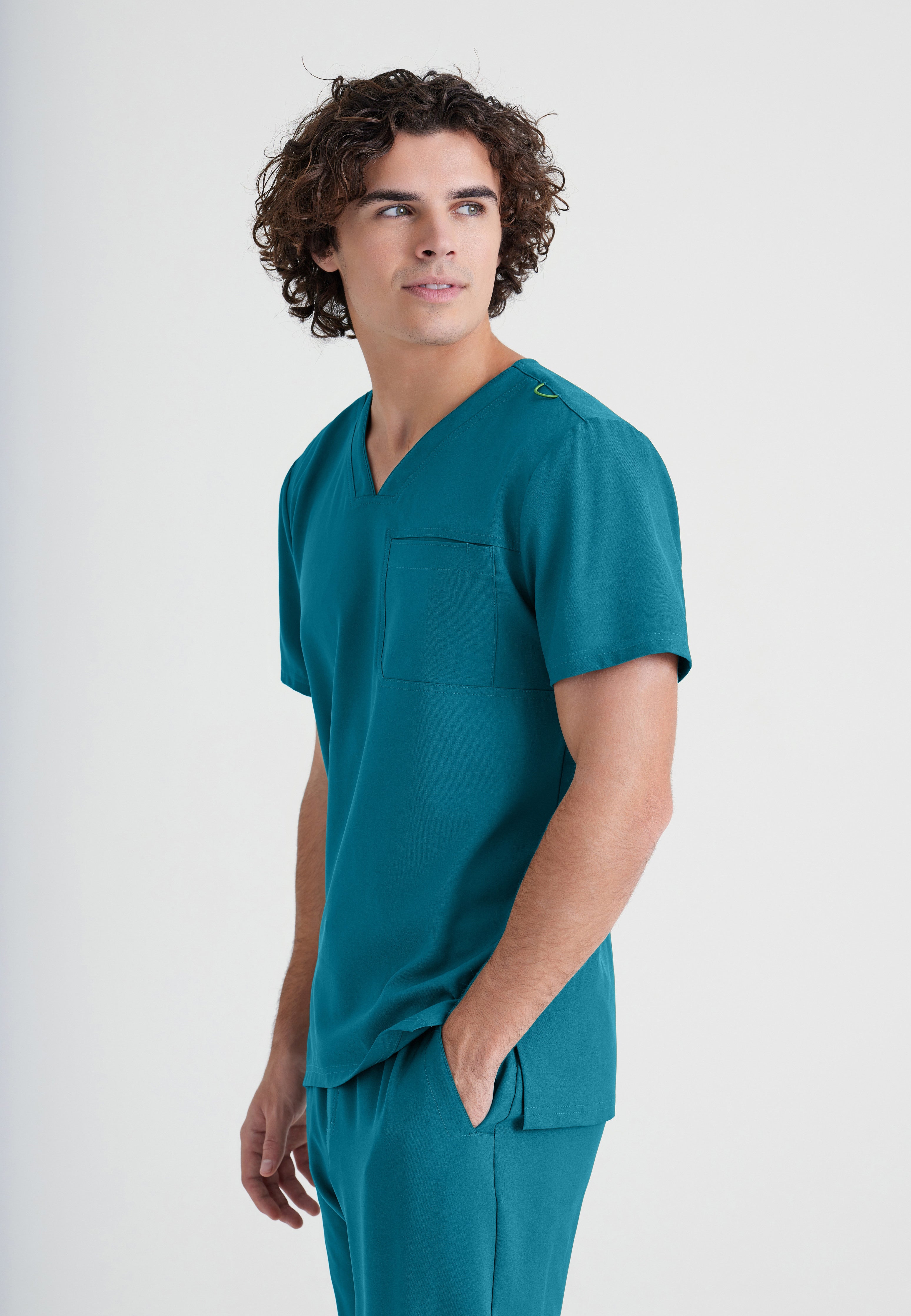 Side View of the Journey 1-Pocket Ciclo® Scrub Top in Bahama from Grey's Anatomy™ by Barco Evolve