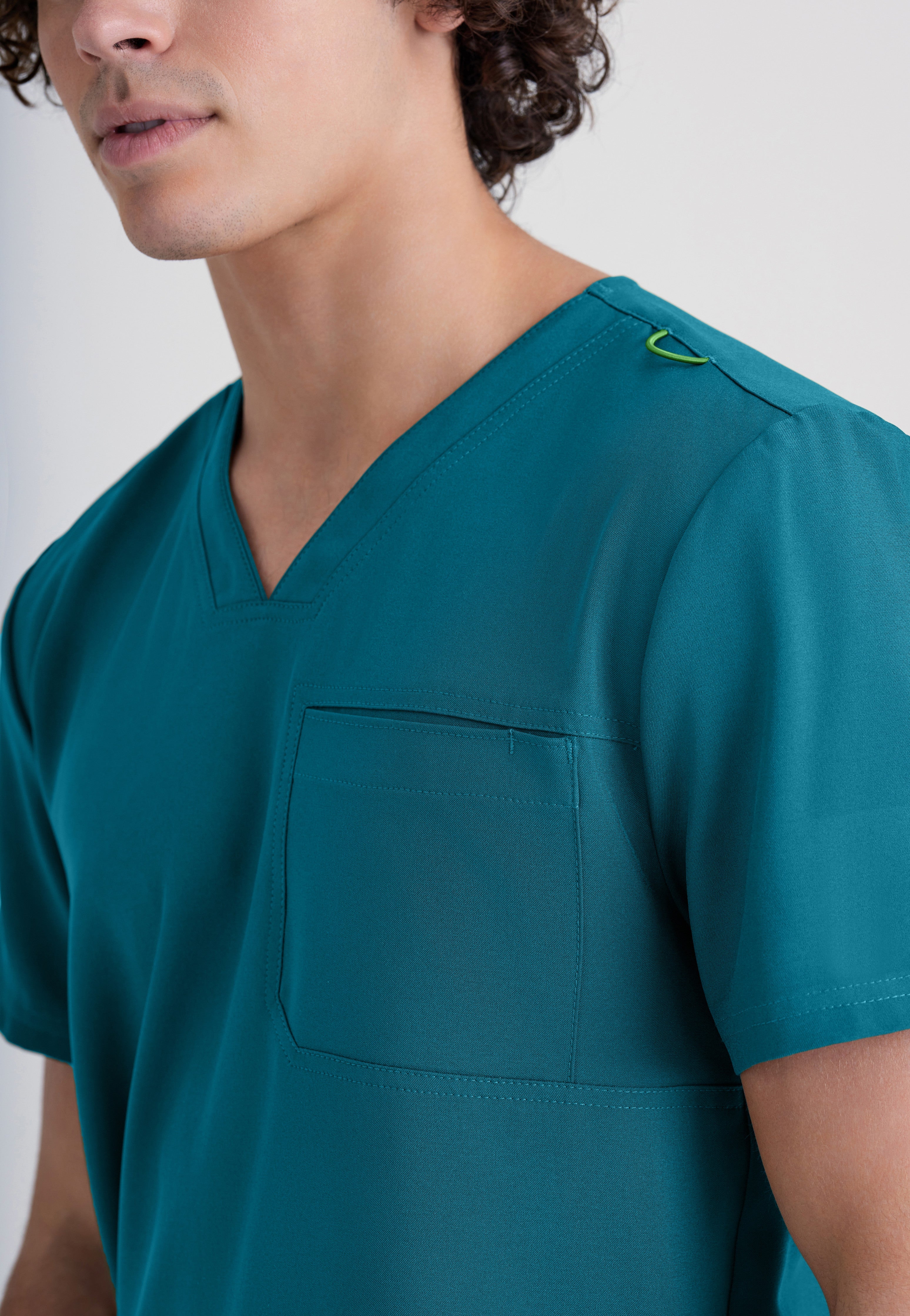 Detail Shot of the Journey 1-Pocket Ciclo® Scrub Top in Bahama from Grey's Anatomy™ by Barco Evolve