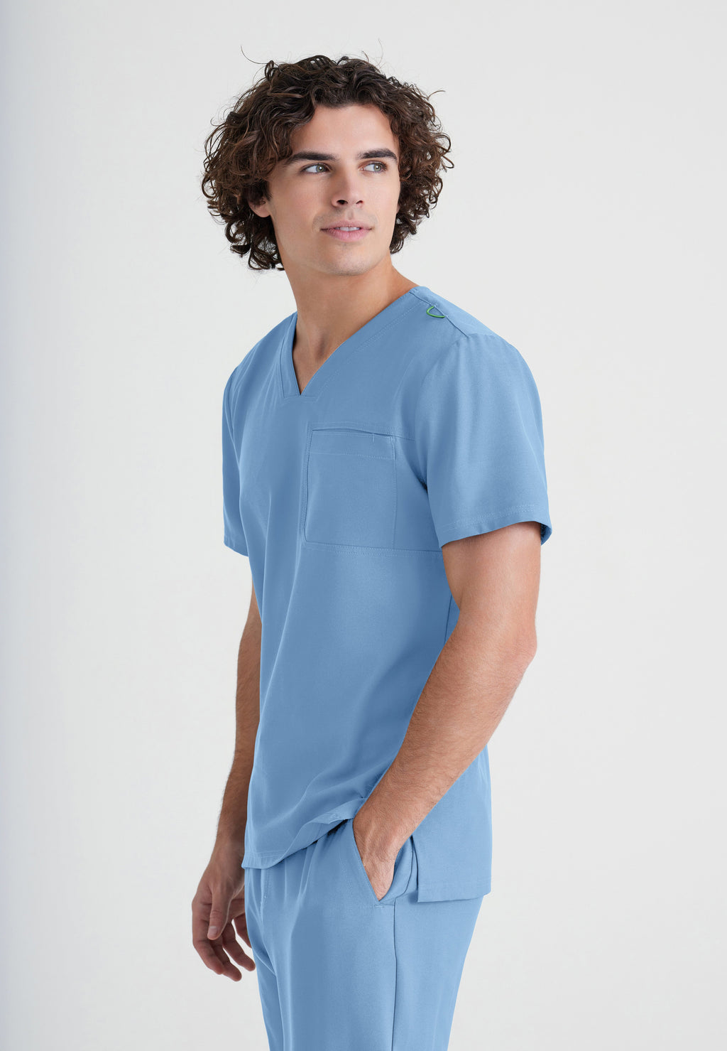 Side View of the Journey 1-Pocket Ciclo® Scrub Top in Ciel Blue from Grey's Anatomy™ by Barco Evolve