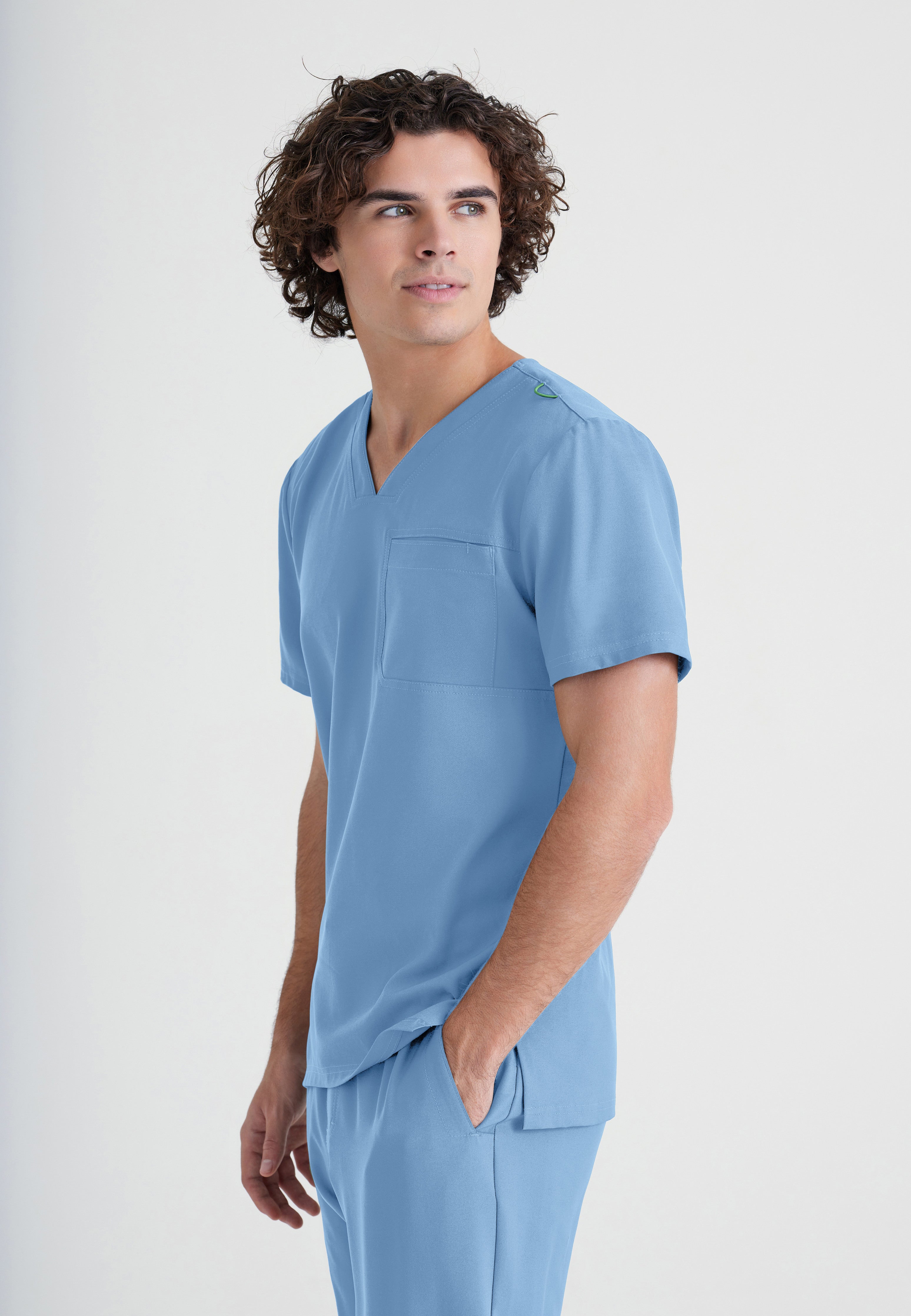 Side View of the Journey 1-Pocket Ciclo® Scrub Top in Ciel Blue from Grey's Anatomy™ by Barco Evolve