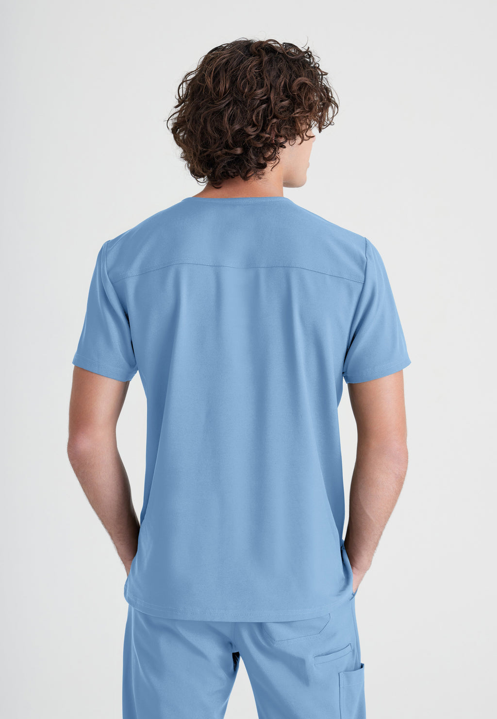 Back View of the Journey 1-Pocket Ciclo® Scrub Top in Ciel Blue from Grey's Anatomy™ by Barco Evolve
