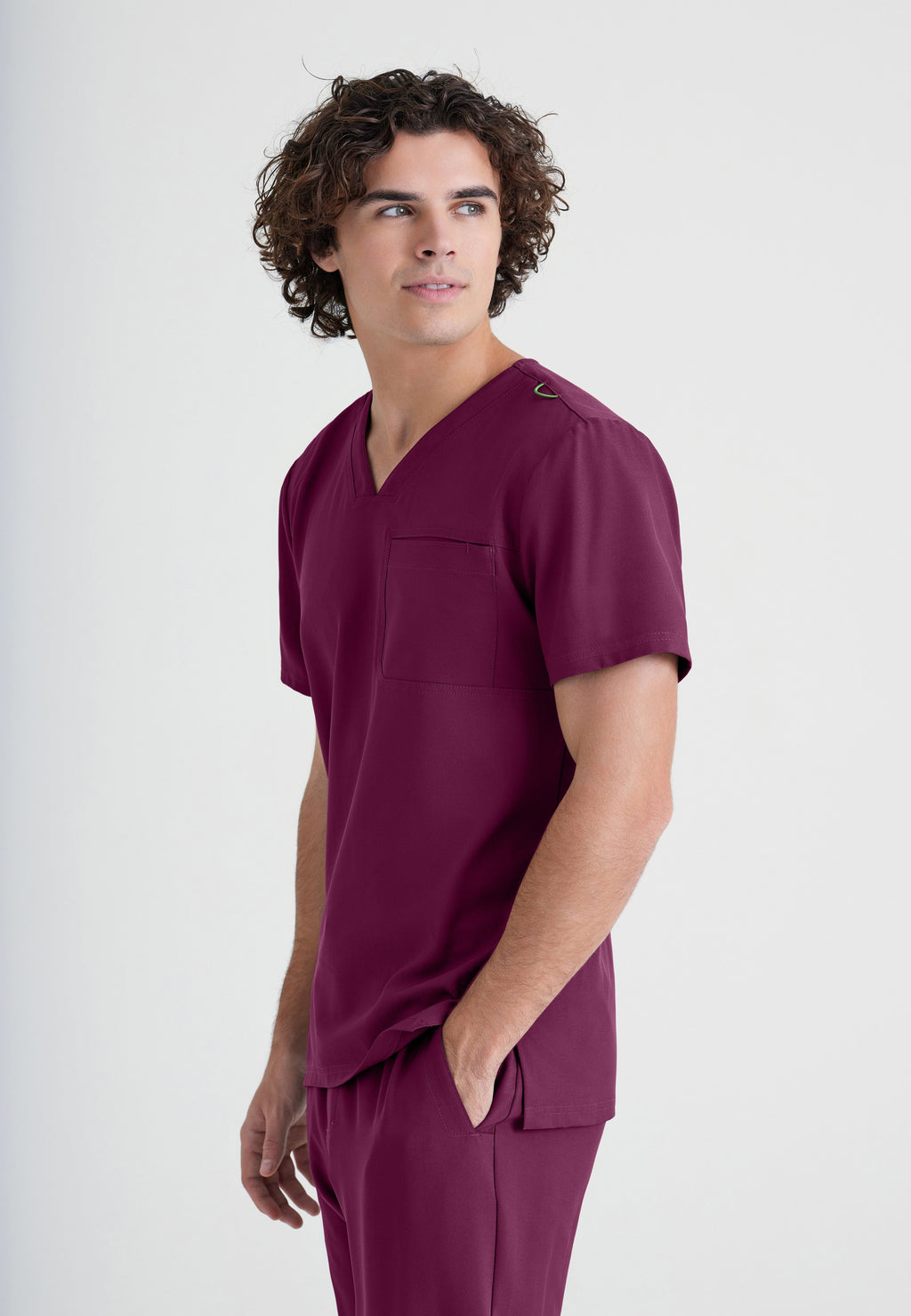 Side View of the Journey 1-Pocket Ciclo® Scrub Top in Wine from Grey's Anatomy™ by Barco Evolve