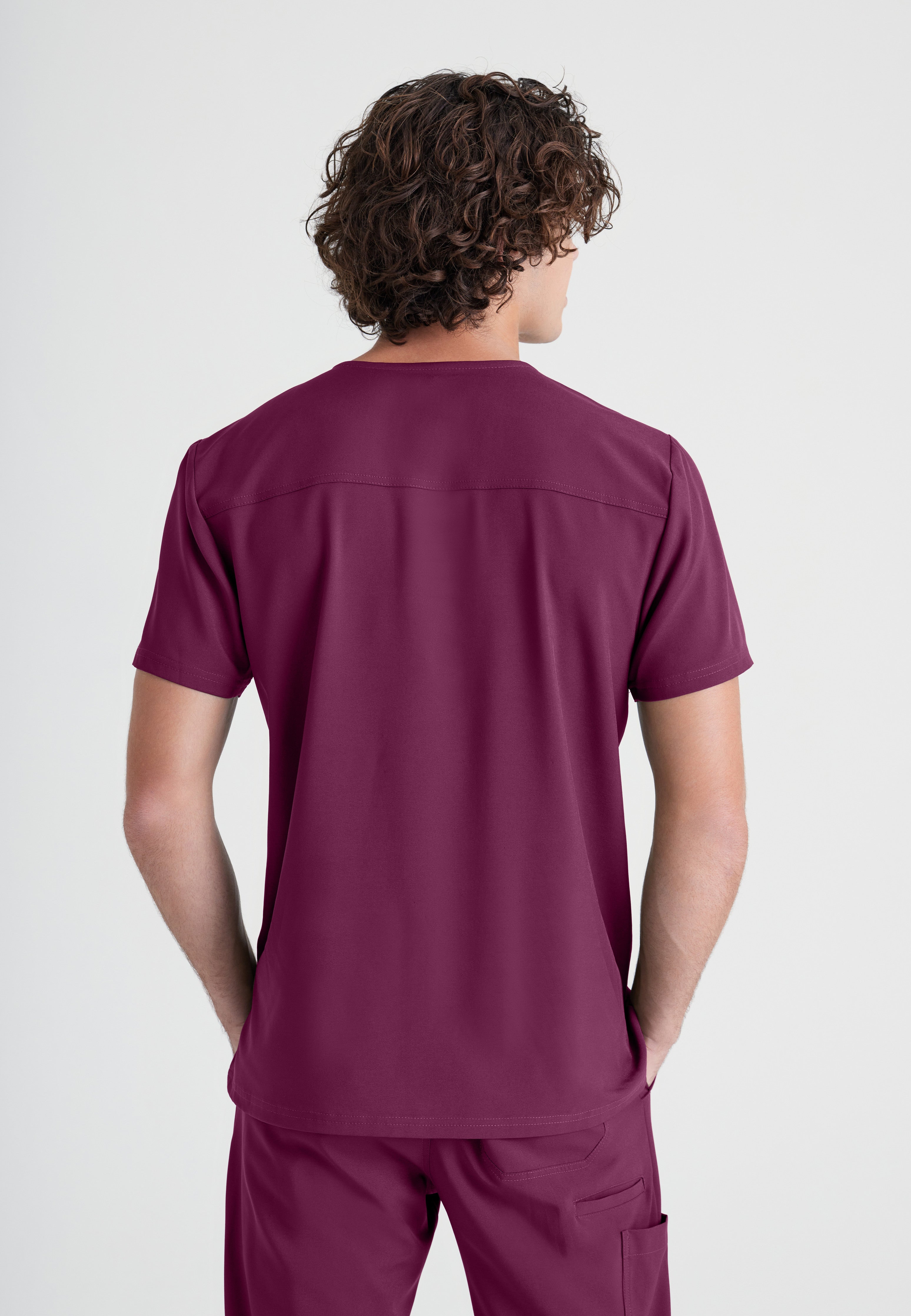 Back View of the Journey 1-Pocket Ciclo® Scrub Top in Wine from Grey's Anatomy™ by Barco Evolve