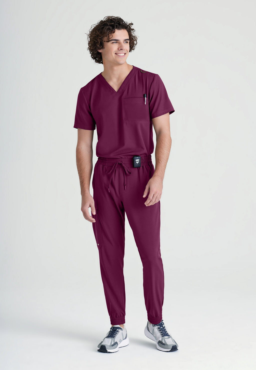 Full Body View of the Voyager 5-Pocket CICLO® Jogger Scrub Pant in Wine from Grey's Anatomy™ by Barco Evolve