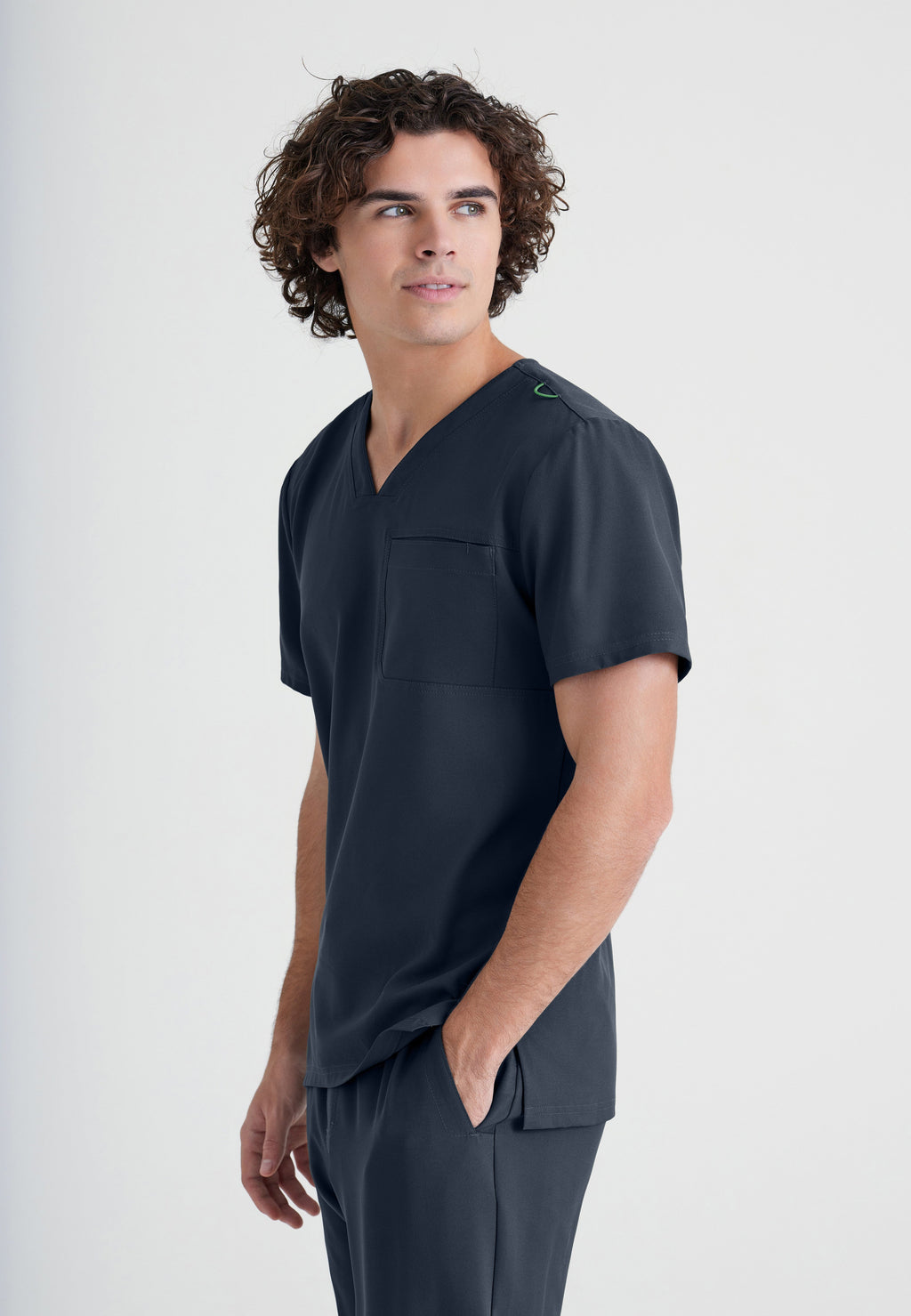 Side View of the Journey 1-Pocket Ciclo® Scrub Top in Steel from Grey's Anatomy™ by Barco Evolve