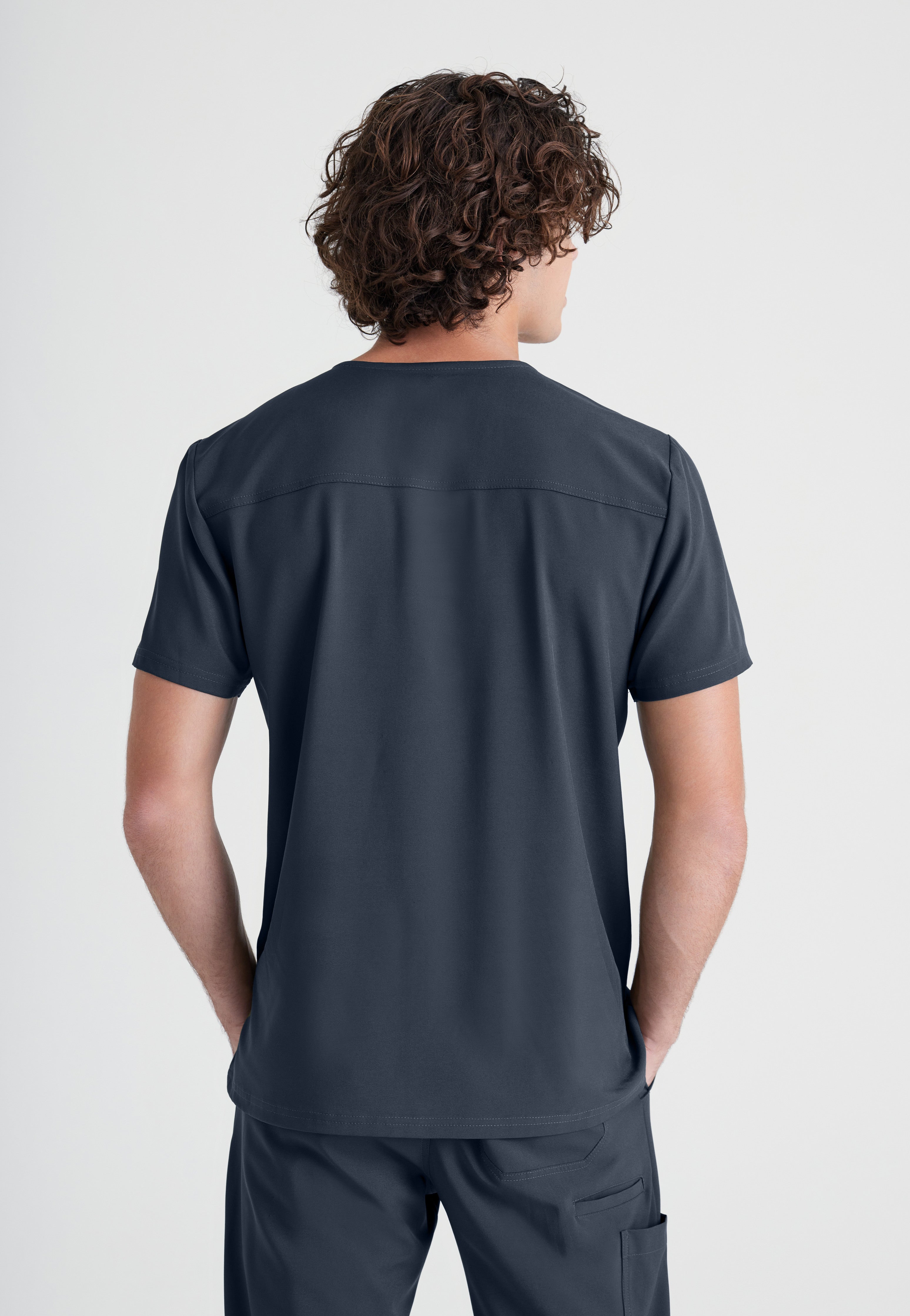 Back View of the Journey 1-Pocket Ciclo® Scrub Top in Steel from Grey's Anatomy™ by Barco Evolve