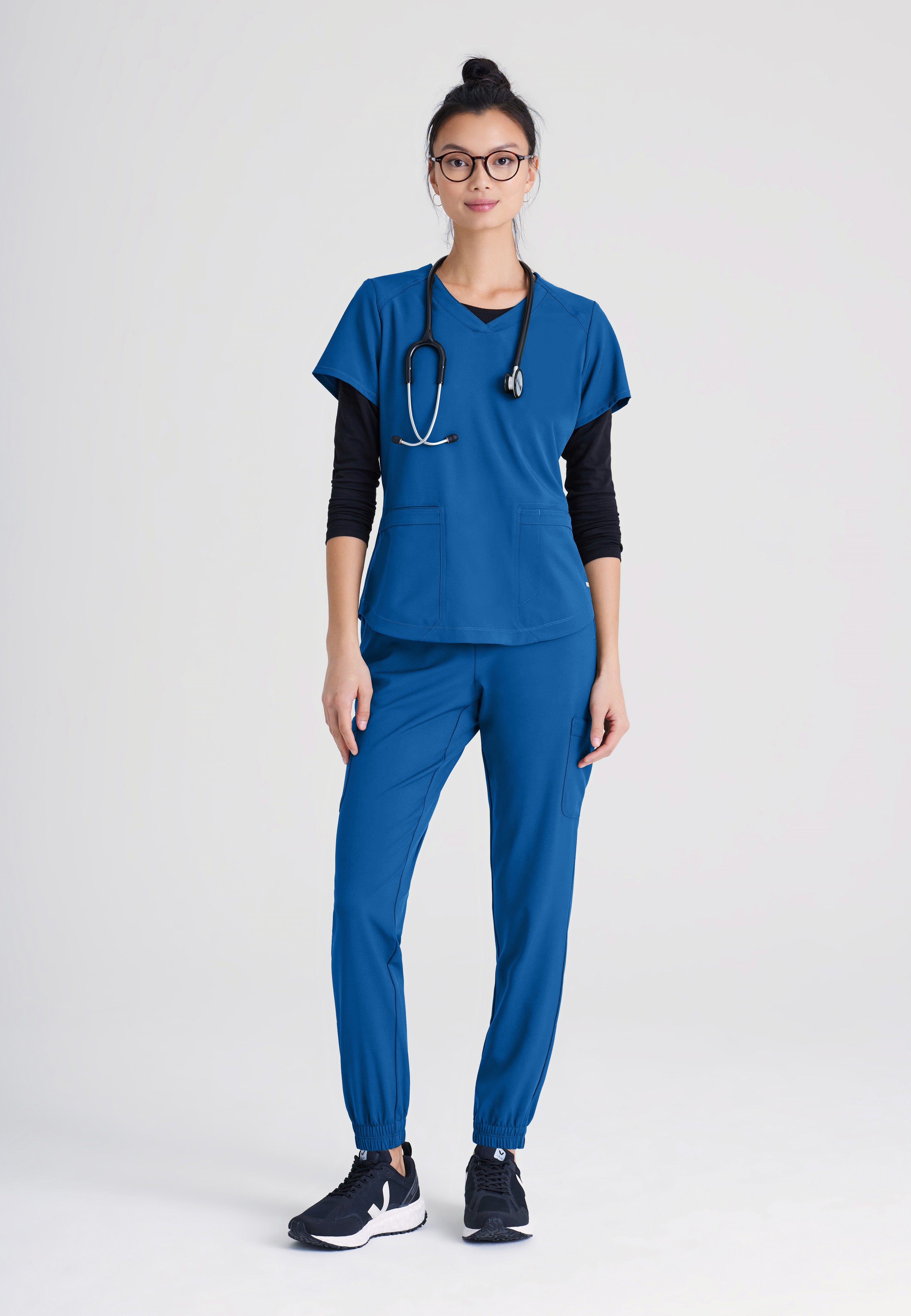 Full Body View of the Terra 6-Pocket Mid-Rise Ciclo® Jogger Scrub Pant in New Royal from Grey's Anatomy™ by Barco Evolve