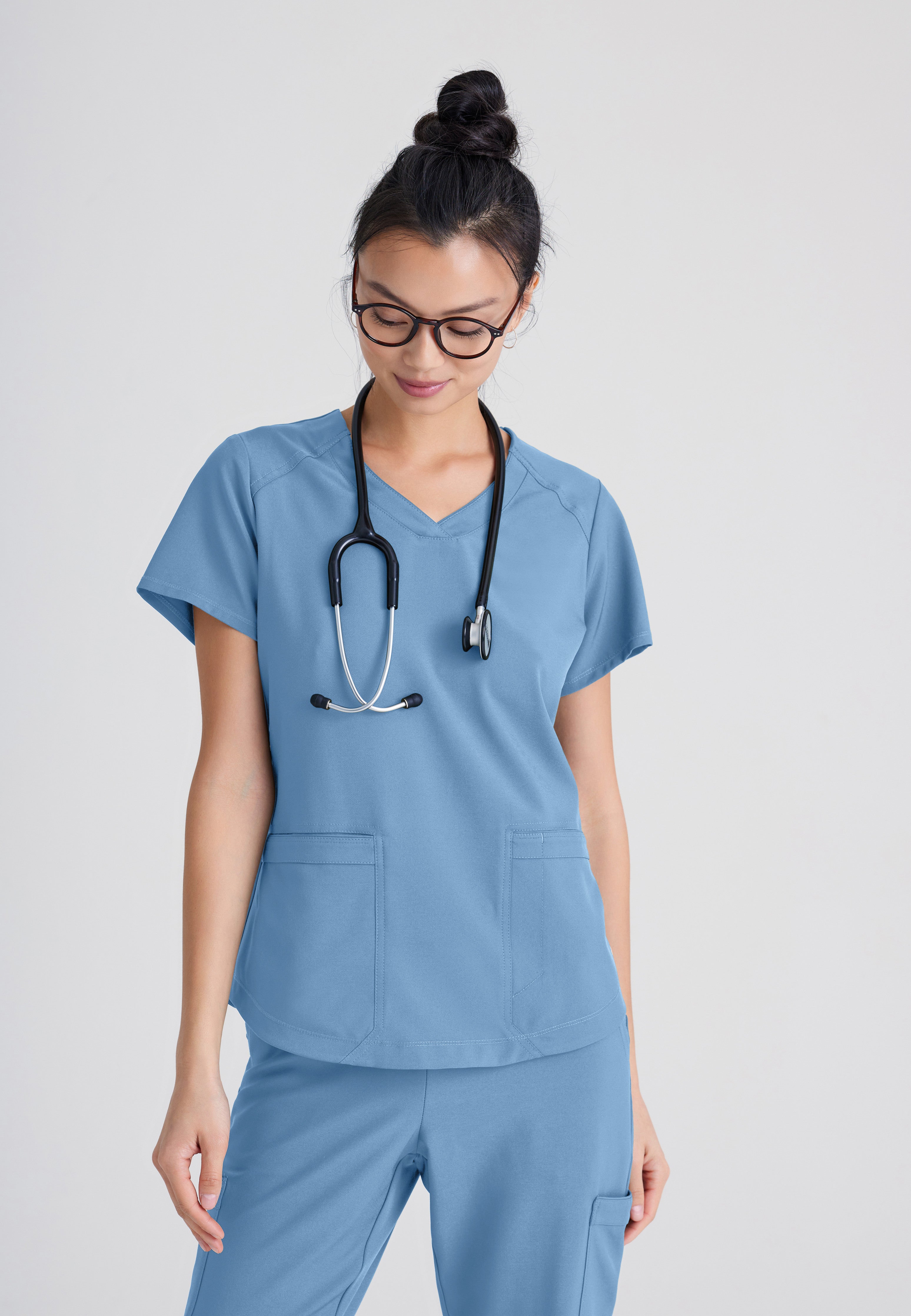 Front View of the Rhythm 2-Pocket Ciclo® Scrub Top in Ciel Blue from Grey's Anatomy™ by Barco Evolve