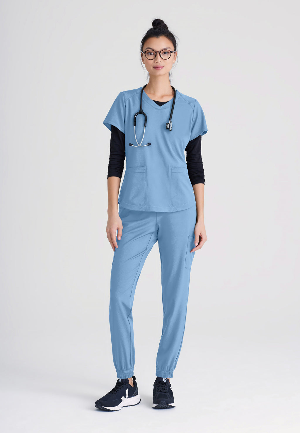 Full Body View of the Rhythm 2-Pocket Ciclo® Scrub Top in Ciel Blue from Grey's Anatomy™ by Barco Evolve