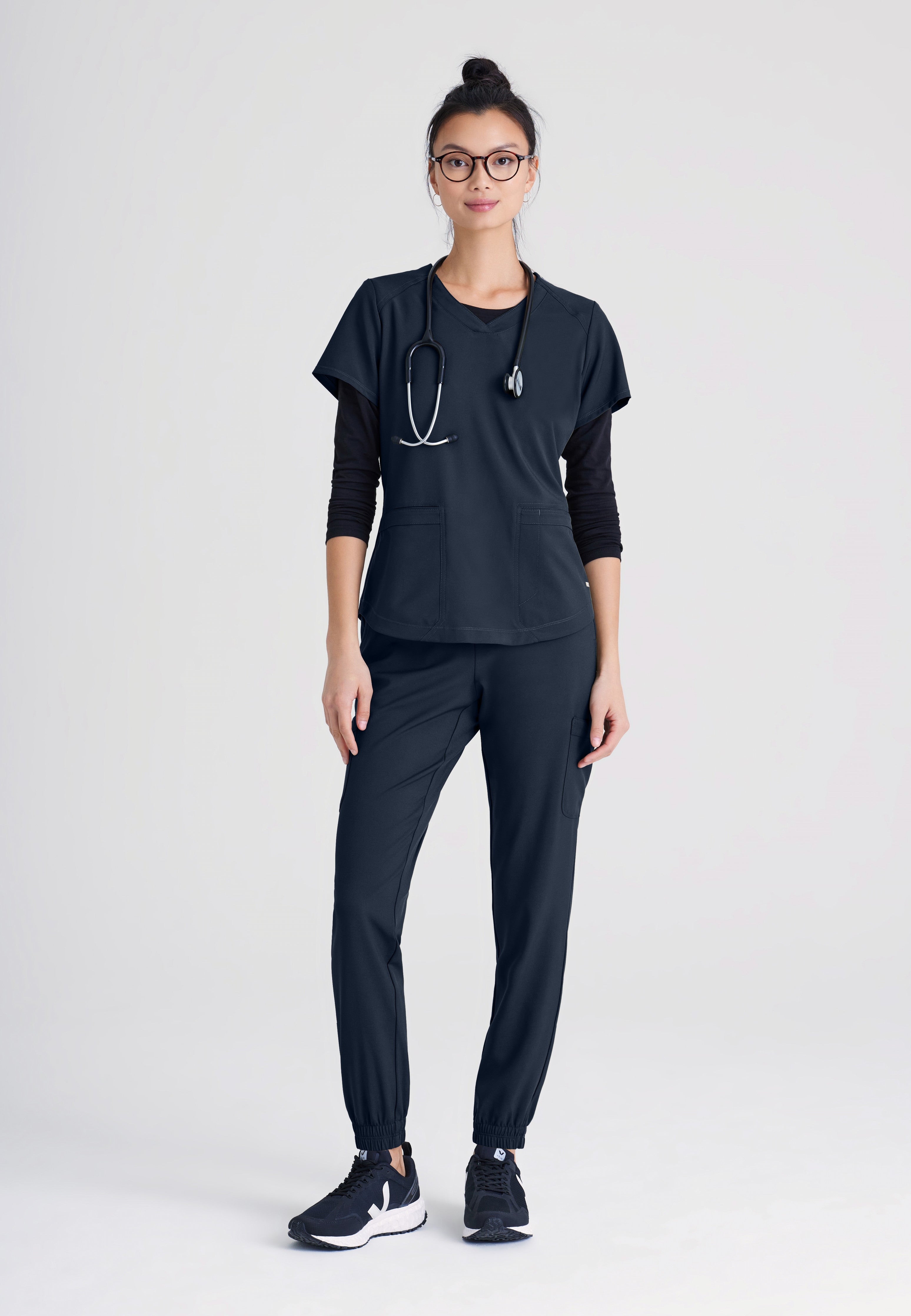 Full Body View of the Rhythm 2-Pocket Ciclo® Scrub Top in Steel from Grey's Anatomy™ by Barco Evolve