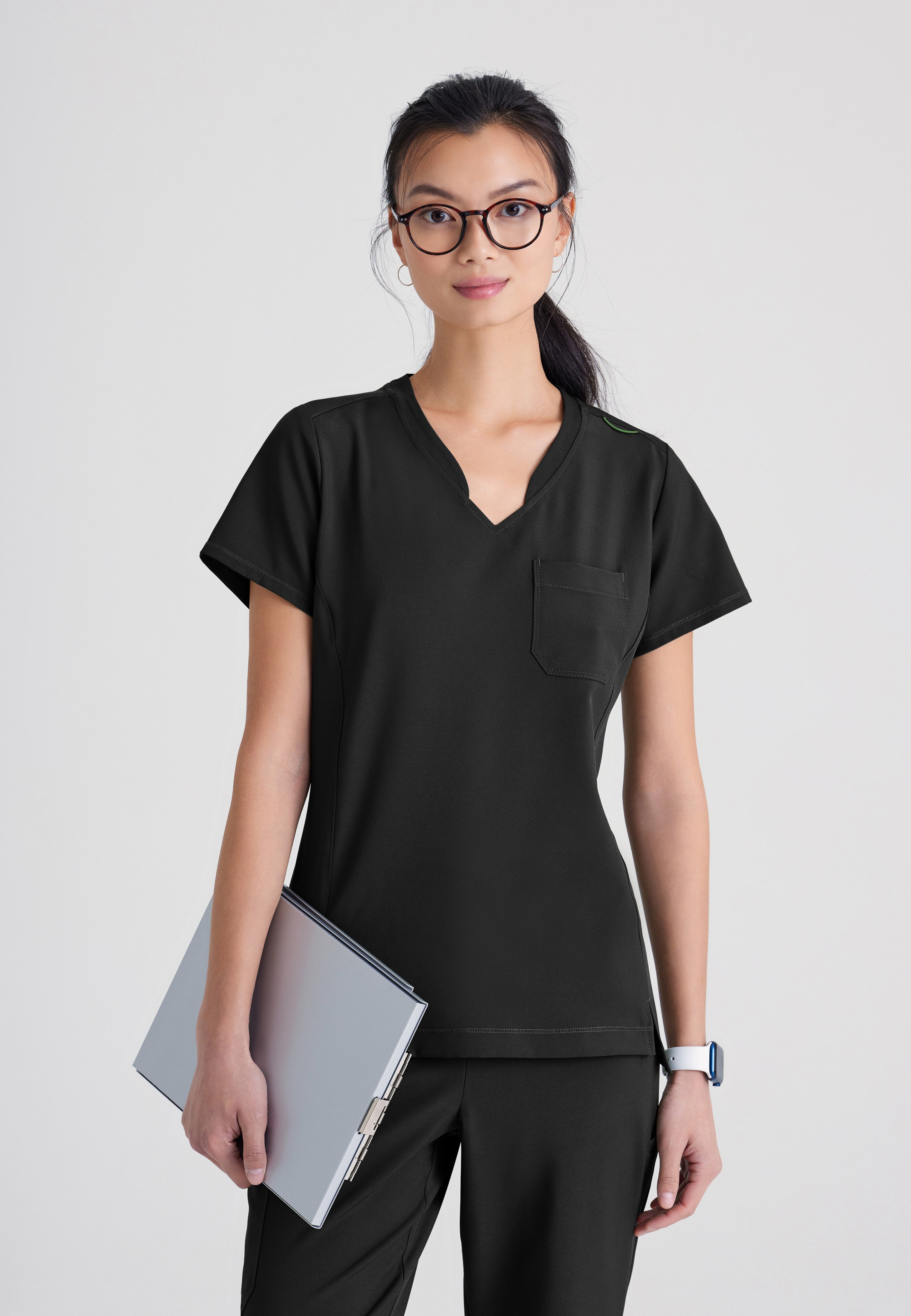 Front View of the Sway 1-Pocket Banded V-Neck Ciclo® Scrub Top in Black from Grey's Anatomy™ by Barco Evolve