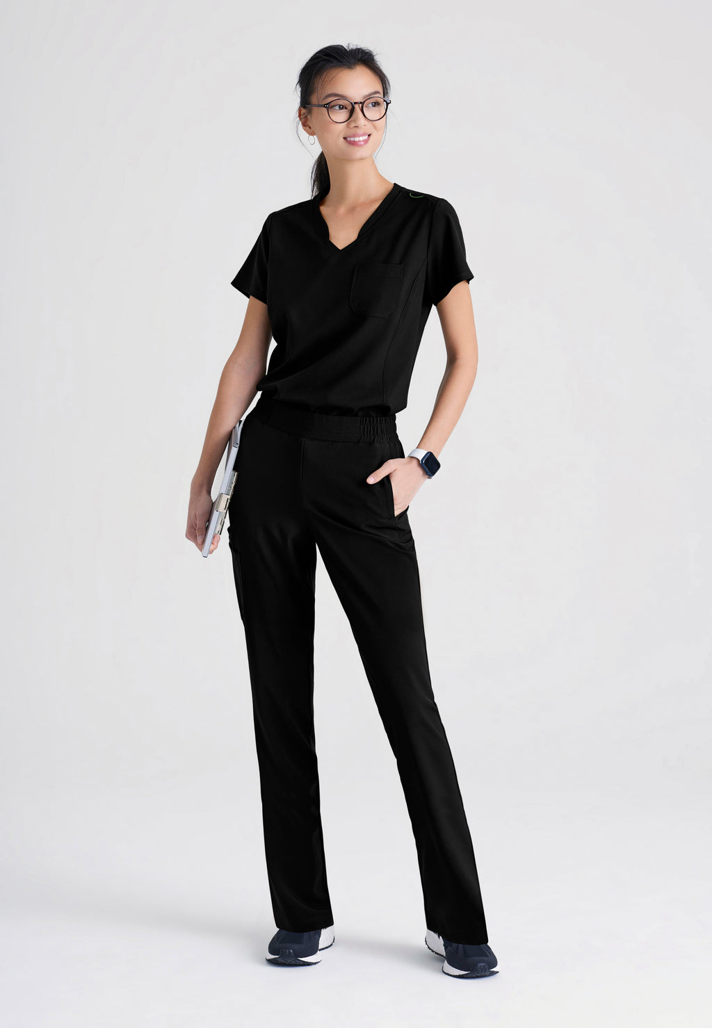 Full Body View of the Sway 1-Pocket Banded V-Neck Ciclo® Scrub Top in Black from Grey's Anatomy™ by Barco Evolve