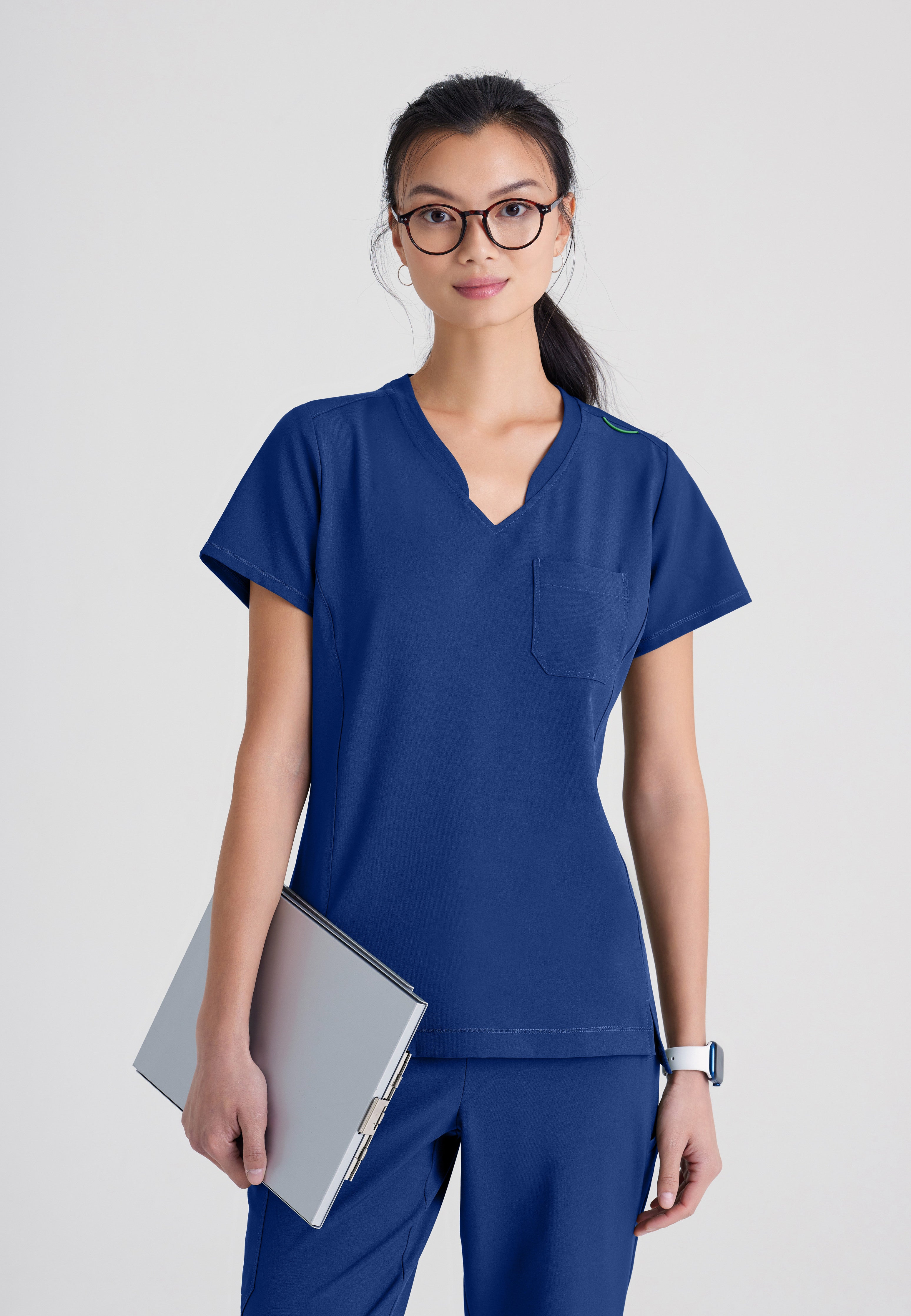 Front View of the Sway 1-Pocket Banded V-Neck Ciclo® Scrub Top in Black from Grey's Anatomy™ by Barco Evolve