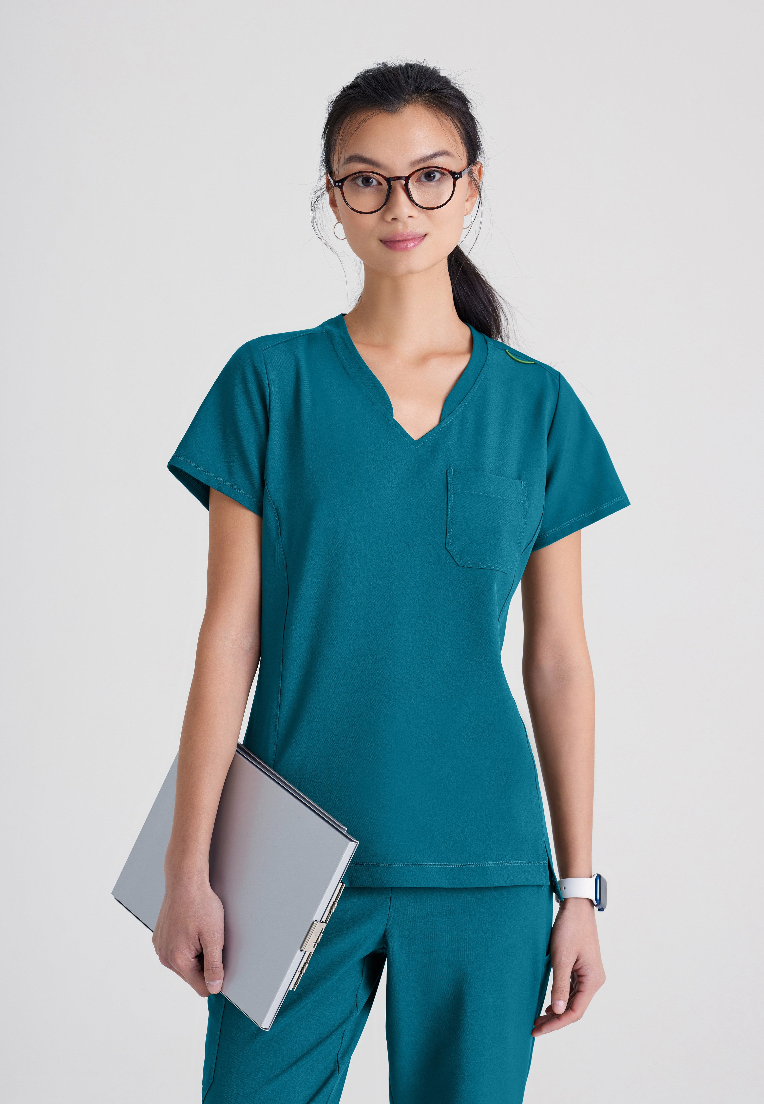 Front View of the Sway 1-Pocket Banded V-Neck Ciclo® Scrub Top in Bahama from Grey's Anatomy™ by Barco Evolve