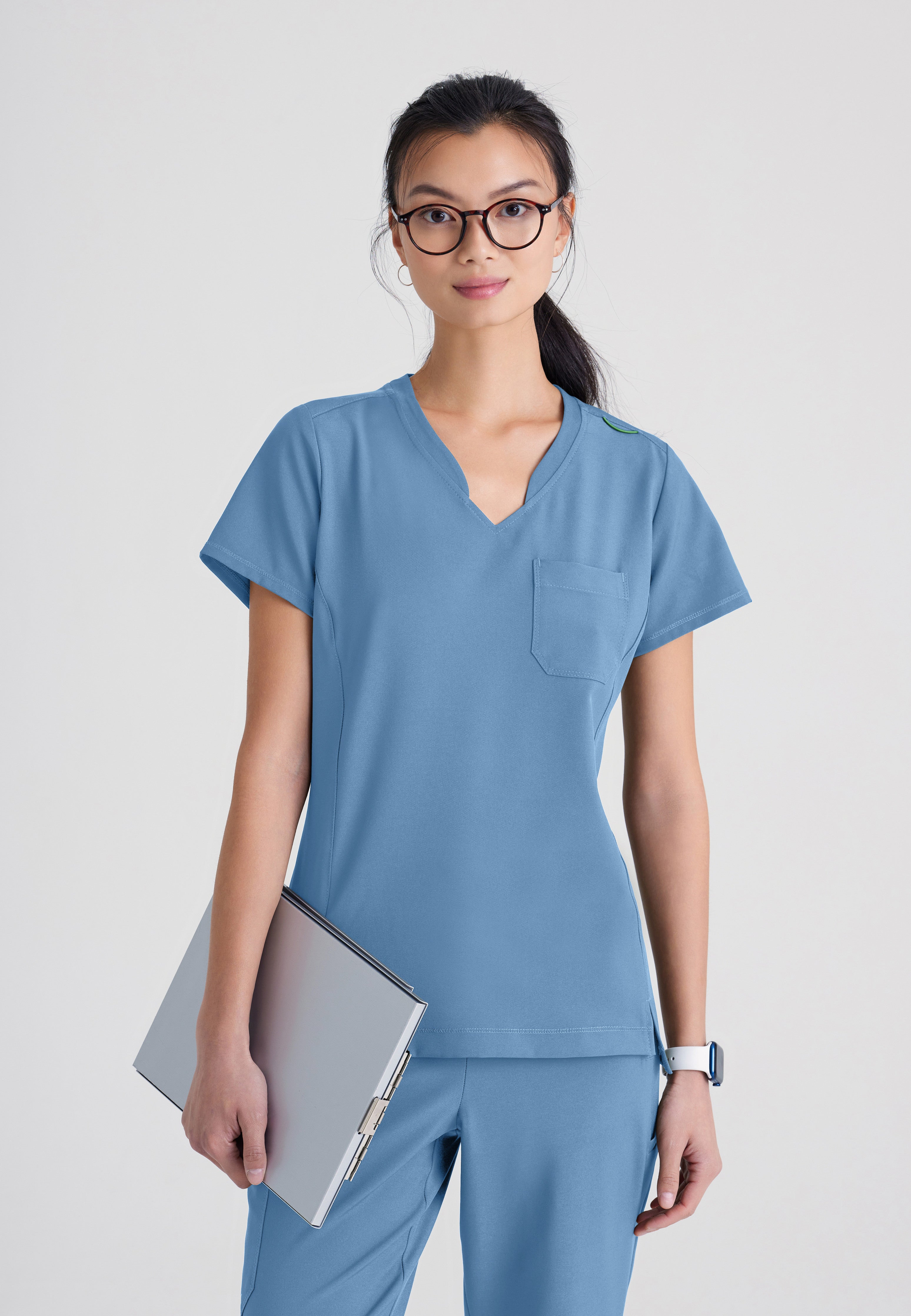 Front View of the Sway 1-Pocket Banded V-Neck Ciclo® Scrub Top in Ciel Blue from Grey's Anatomy™ by Barco Evolve