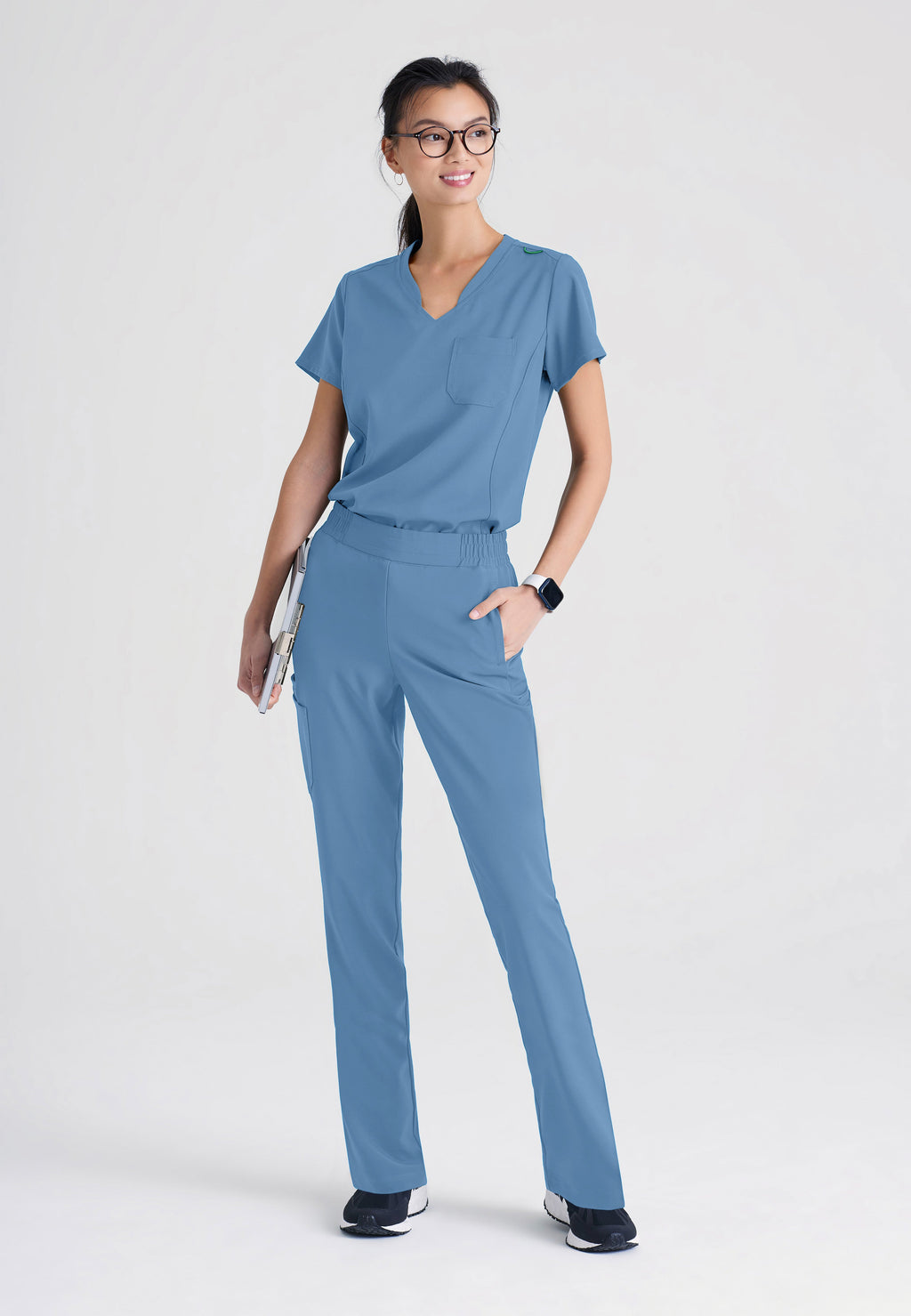 Full Body View of the Sway 1-Pocket Banded V-Neck Ciclo® Scrub Top in Ciel Blue from Grey's Anatomy™ by Barco Evolve