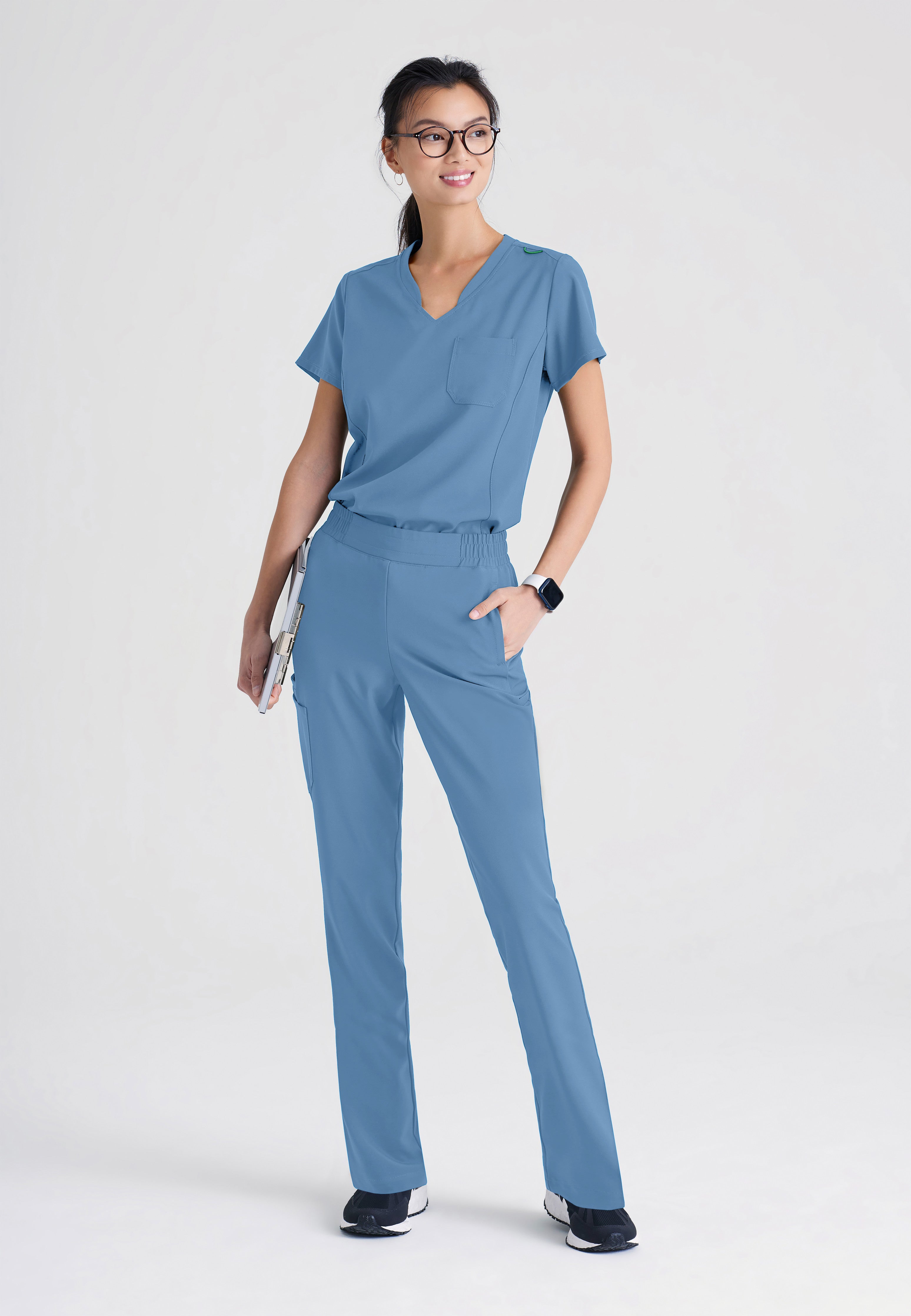 Full Body View of the Sway 1-Pocket Banded V-Neck Ciclo® Scrub Top in Ciel Blue from Grey's Anatomy™ by Barco Evolve